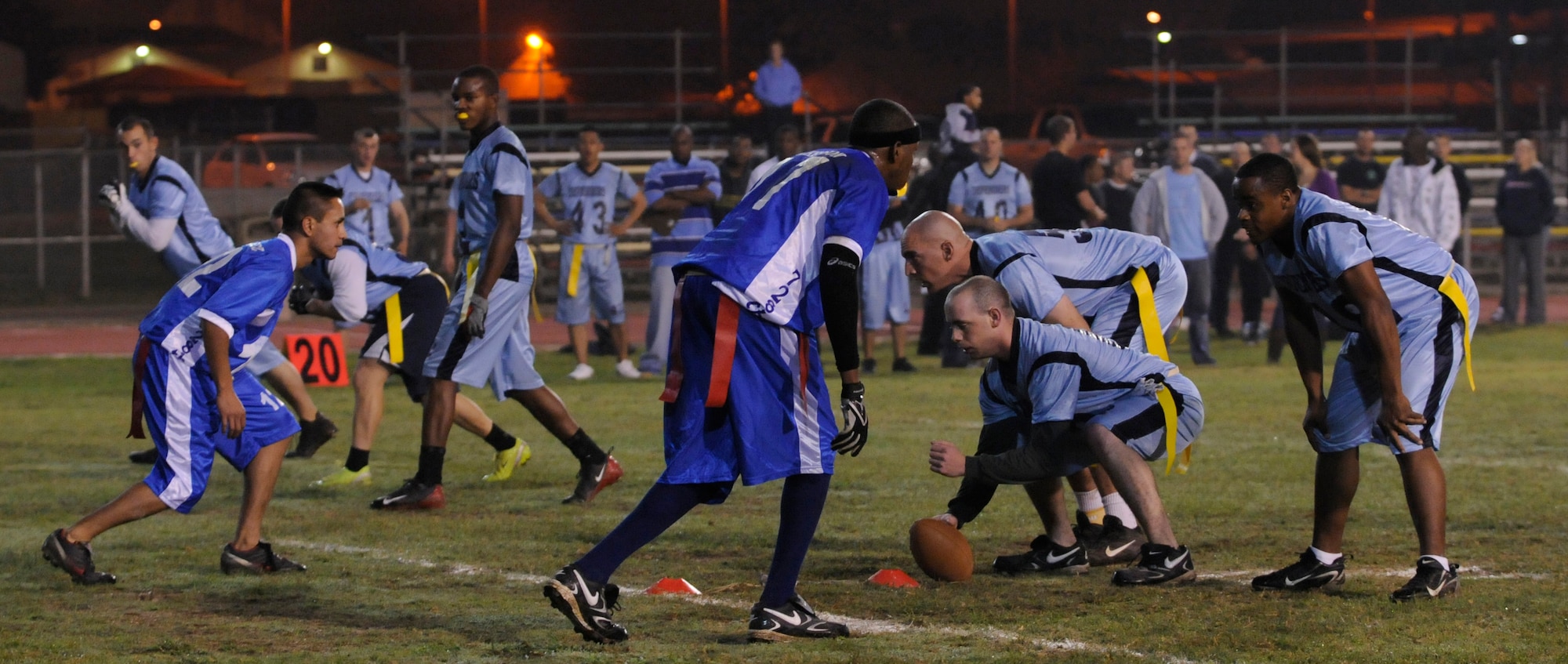 Members of the 728th Air Mobility Squadron anticipate the snap from the 39th Security Forces Squadron during a semi-final intramural flag football game at the Incirlik football field, Wednesday, Nov. 11, 2009. The winning team proceeded to the intramural championship game. The 728th AMS defeated the 39th SFS 19 to 14. (U.S. Air Force photo/Airman 1st Class Amber Ashcraft)