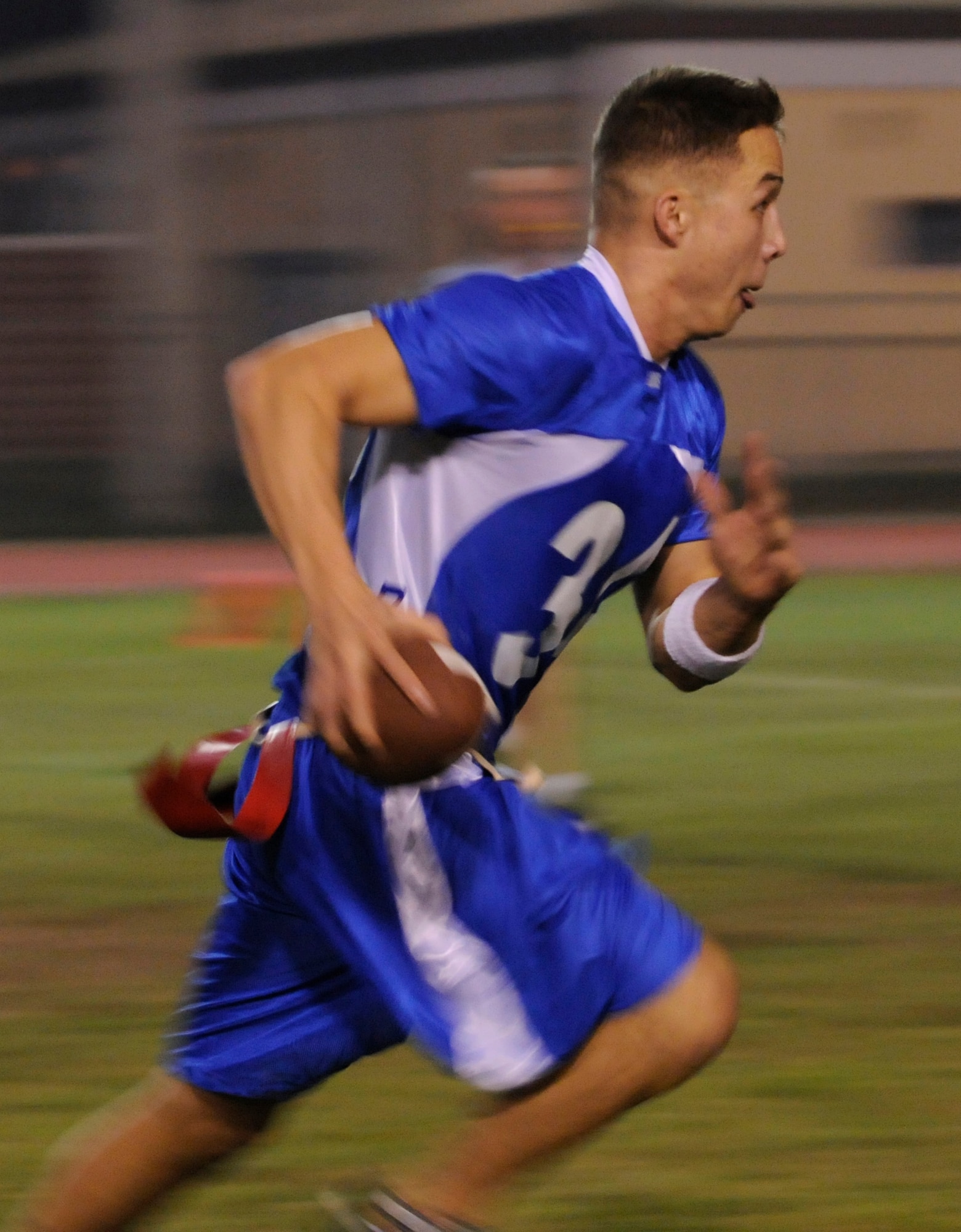 Senior Airman Danny Hagglund, 728th Air Mobility Squadron, runs past the opposing team to score a touchdown during a semi-final intramural flag football game at the Incirlik football field, Wednesday, Nov. 11, 2009. The winning team proceeded to the intramural championship game. The 728th AMS defeated the 39th SFS 19 to 14. (U.S. Air Force photo/Airman 1st Class Amber Ashcraft)