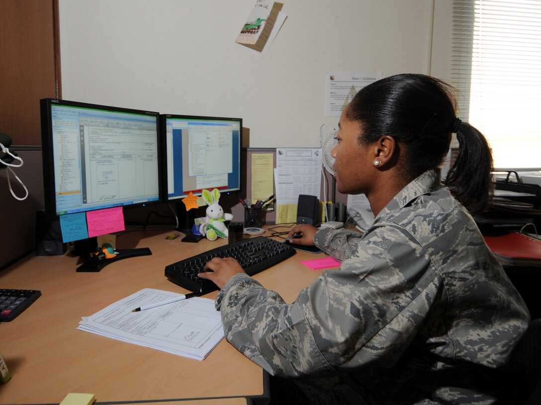 Ms. Latiffany Watts, 379th Expeditionary Comptroller Squadron budget analyst, manages contractor and coalition partner reimbursements at a deployed location in Southwest Asia, Nov. 12, 2009. The 379 ECPTS handles all military pay issues for deployed members, as well as managing the budget for the 379th Air Expeditionary Wing. Ms. Watts is deployed from Robins Air Force Base, Ga. in support of operations Iraqi Freedom and Enduring Freedom. (U.S. Air Force Photo/Tech. Sgt. Jason W. Edwards)