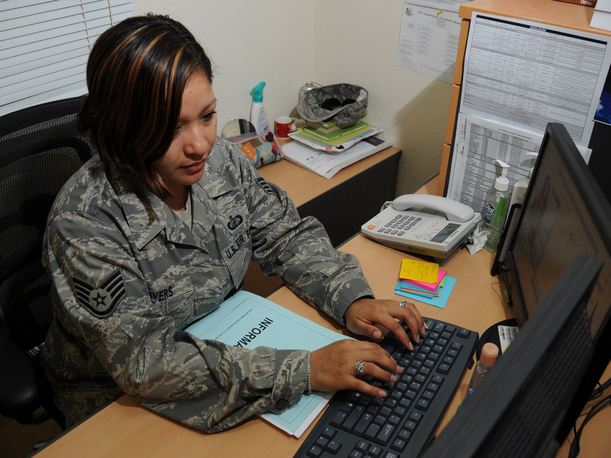 Staff Sgt. Karina Myers, 379th Expeditionary Comptroller Squadron customer service technician, prepares a U.S. savings deposit collection voucher for a permanent party member at a deployed location in Southwest Asia, Nov. 12, 2009. The 379 ECPTS handles all military pay issues for deployed members, as well as managing the budget for the 379th Air Expeditionary Wing. Sergeant Myers is deployed from Andersen Air Force Base, Guam in support of operations Iraqi Freedom and Enduring Freedom. (U.S. Air Force Photo/Tech. Sgt. Jason W. Edwards)