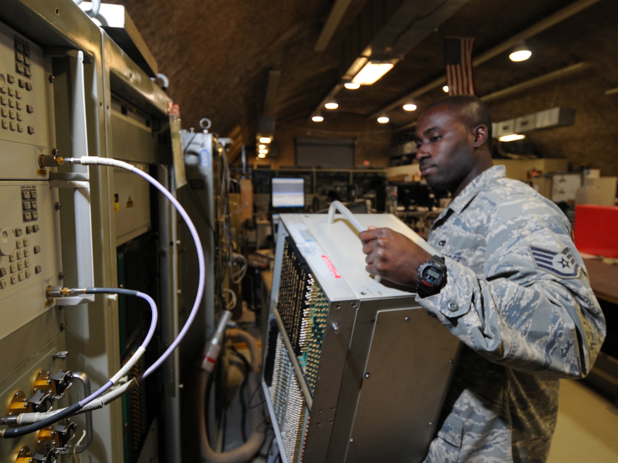 Staff Sgt. Lawrence Robinson, 379th Expeditionary Maintenance Squadron avionics technician, installs an interface test adapter for testing of line replacement units at a deployed location in Southwest Asia, Nov. 9, 2009. The 379 EMXS avionics flight provides support for F-15 Eagles which are deployed to Bagram AB, Afghanistan. Sergeant Robinson is deployed from Seymour-Johnson Air Force Base, N.C. in support of operations Iraqi Freedom and Enduring Freedom. (U.S. Air Force Photo/Tech. Sgt. Jason W. Edwards)