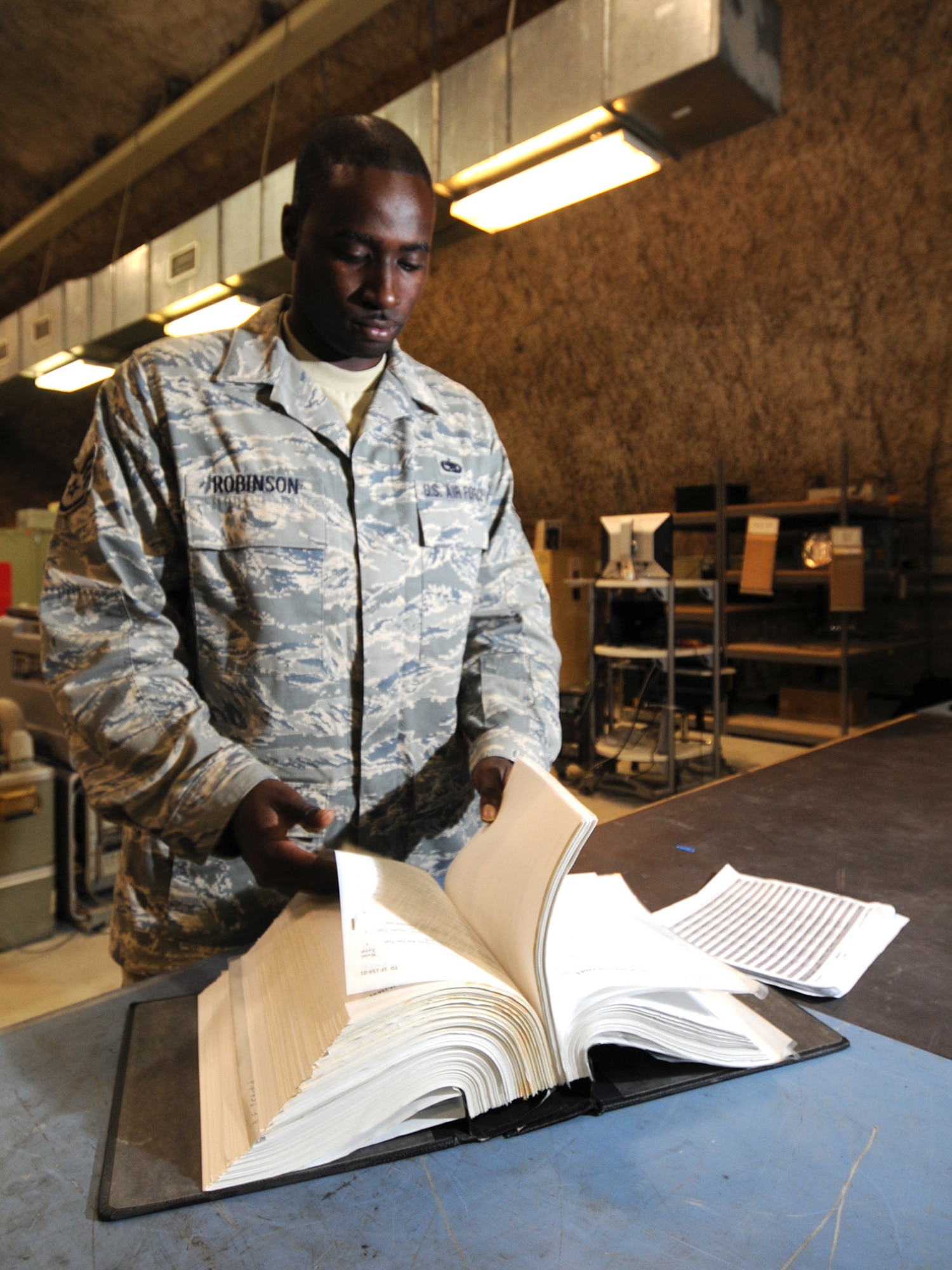 Staff Sgt. Lawrence Robinson, 379th Expeditionary Maintenance Squadron avionics technician, inventories a technical order to ensure current accuracy at a deployed location in Southwest Asia, Nov. 9, 2009. The 379 EMXS avionics flight provides support for F-15 Eagles which are deployed to Bagram AB, Afghanistan. Sergeant Robinson is deployed from Seymour-Johnson Air Force Base, N.C. in support of operations Iraqi Freedom and Enduring Freedom. (U.S. Air Force Photo/Tech. Sgt. Jason W. Edwards)