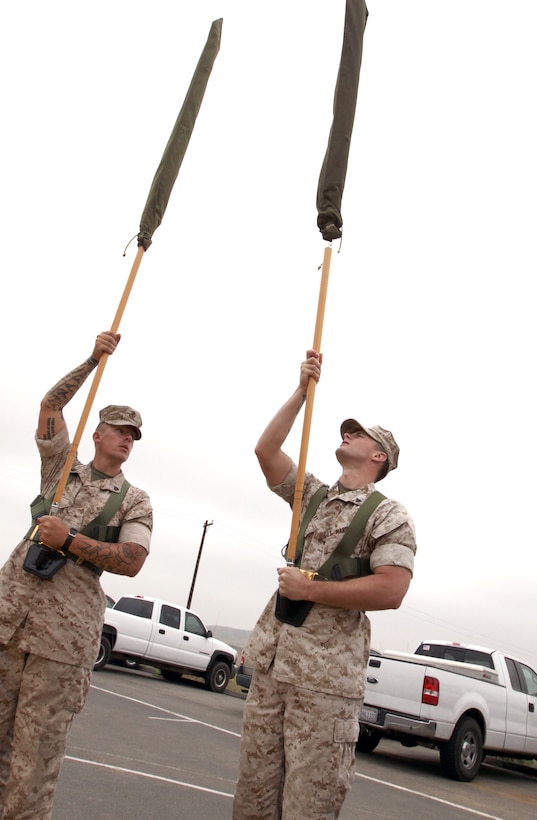 Sgt. Craig Rinehart,left, the new Marine Corps Base Camp Pendleton Color Sergeant, practices drill for an upcoming color guard with Cpl. Russell Beery, a military policeman and a member of the color guard, May 13.
