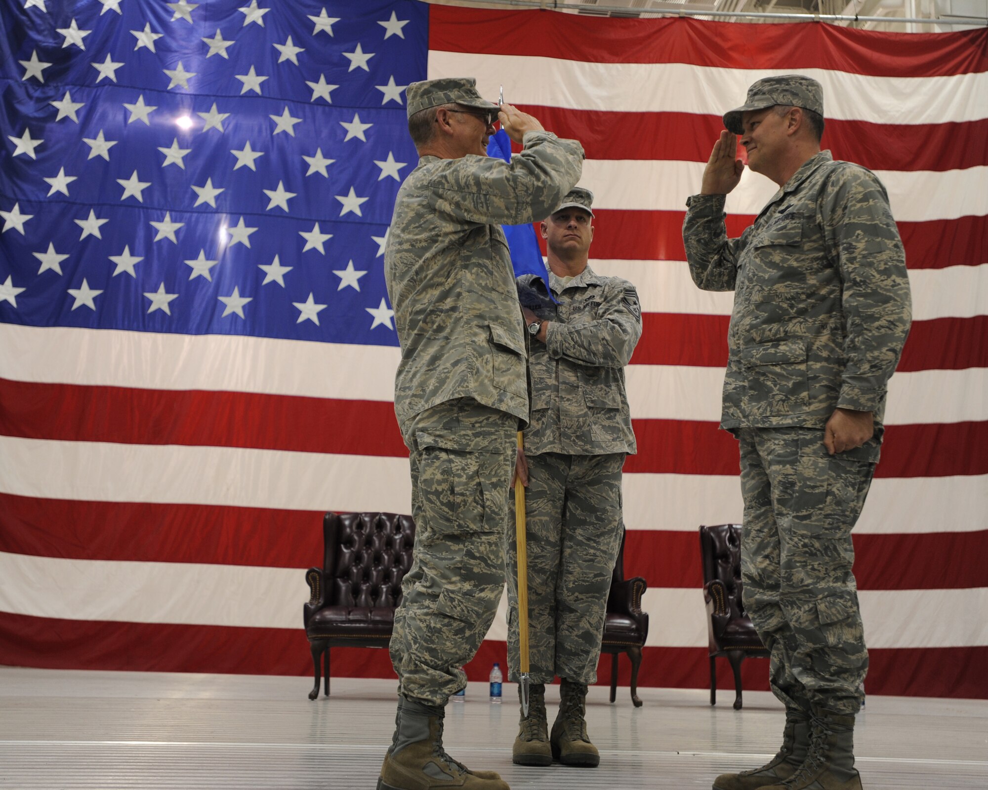 Col. Donald L. Shaffer (right), 319th Air Refueling Wing commander, salutes Lt. Gen. Robert R. Allardice (left), 18th Air Force commander, during a change-of-command ceremony Nov. 13 at Grand Forks Air Force Base. Colonel Shaffer replaced Col. John E. Michel, who will now serve as the Air Mobility Command commander’s executive officer. (U.S. Air Force photo by Staff Sgt. Suellyn Nuckolls)