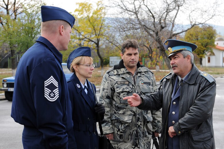 Chief Master Sgt. Pamela Derrow and Chief Master Sgt. David Lawrence discuss enlisted force development issues with Warrant Officer Ivo Bakardijiva, the acting chief master sergeant of the Bulgarian air force (right) and Bulgarian Chief Master Sgt. Hristo Botev, the command chief for Krumovo Air Force Base, Bulgaria. Chief Derrow is the USAFE command chief and Chief Lawrence is the Kipling NCO Academy commandant. (U.S. Air Force photo/Master Sgt. Timothy Barfield)
