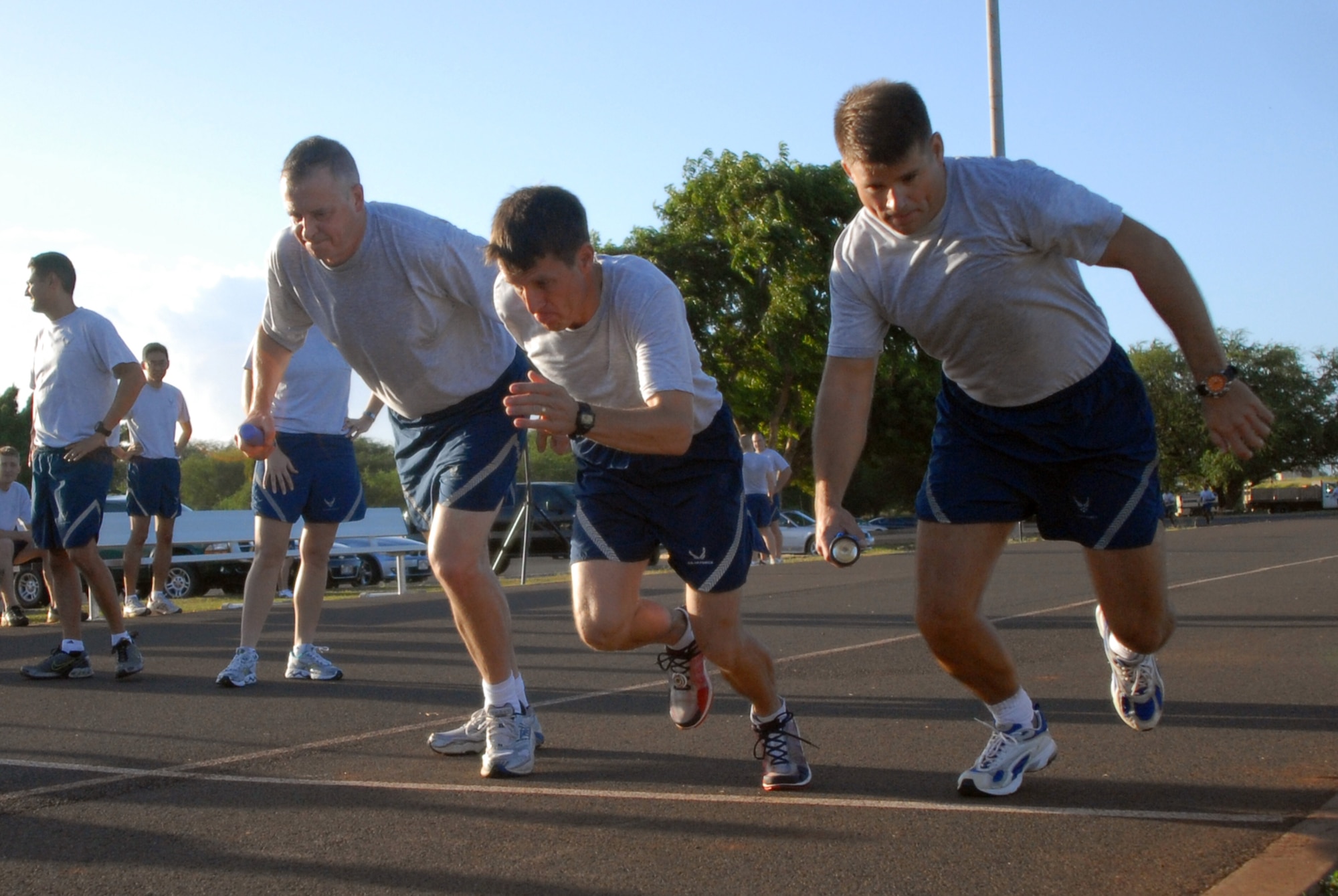 Members of 13th Air Force begin a relay race during Jungle Day Nov. 13 at Hickam Air Force Base, Hawaii. The Jungle Day tradition originated when the organization was assigned to Andersen Air Force Base, Guam, and gives 13th Air Force members a chance to have fun and give back to the local community. (U.S. Air Force photo/Senior Airman Gustavo Gonzalez)