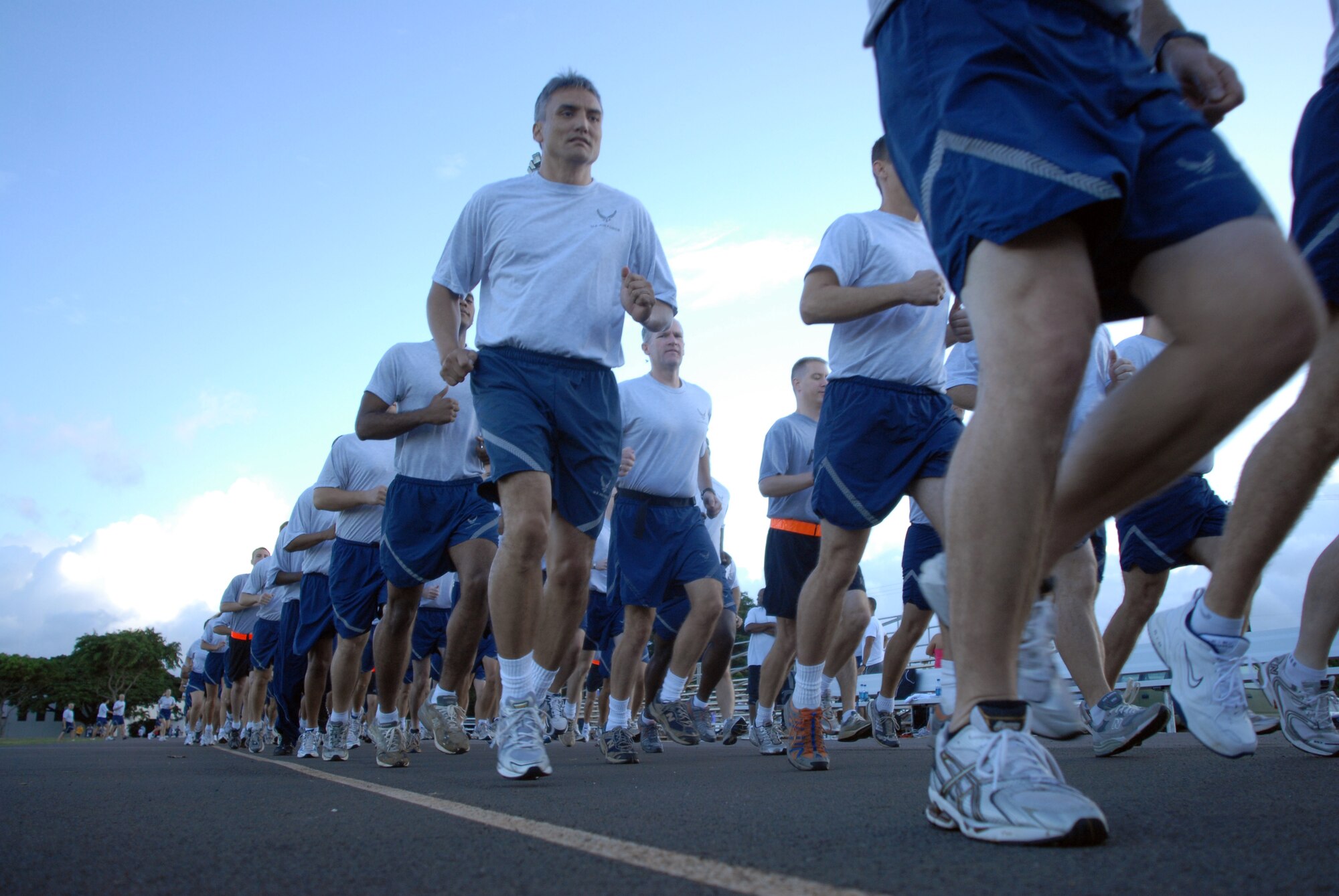 Members of 13th Air Force take part in warrior run during Jungle Day Nov. 13 at Hickam Air Force Base, Hawaii. The Jungle Day tradition originated when the organization was assigned to Andersen Air Force Base, Guam, and gives 13th Air Force members a chance to have fun and give back to the local community. (U.S. Air Force photo/Senior Airman Gustavo Gonzalez)