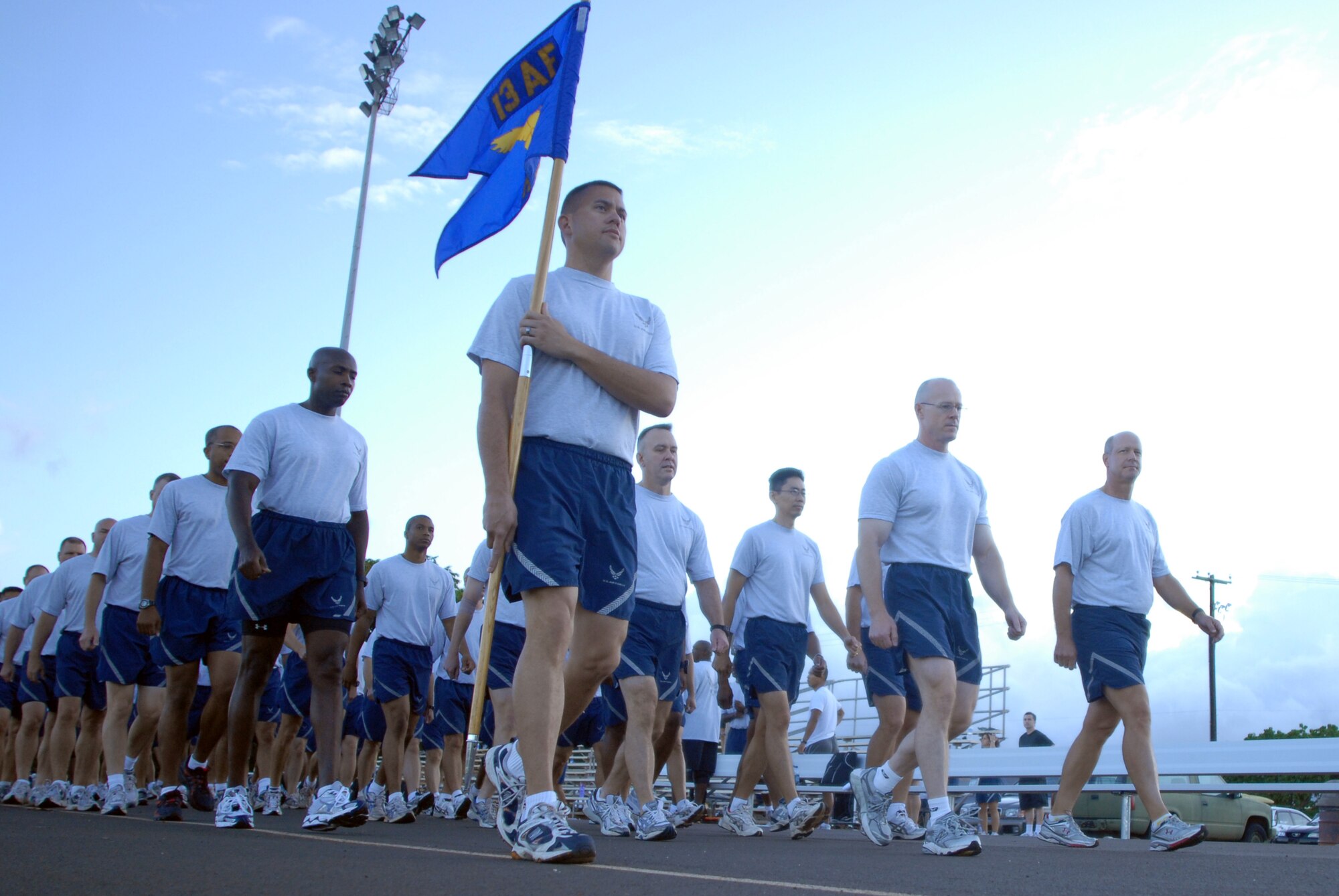 Members of 13th Air Force march before beginning a warrior run during Jungle Day Nov. 13 at Hickam Air Force Base, Hawaii. The Jungle Day tradition originated when the organization was assigned to Andersen Air Force Base, Guam, and gives 13th Air Force members a chance to have fun and give back to the local community. (U.S. Air Force photo/Senior Airman Gustavo Gonzalez)