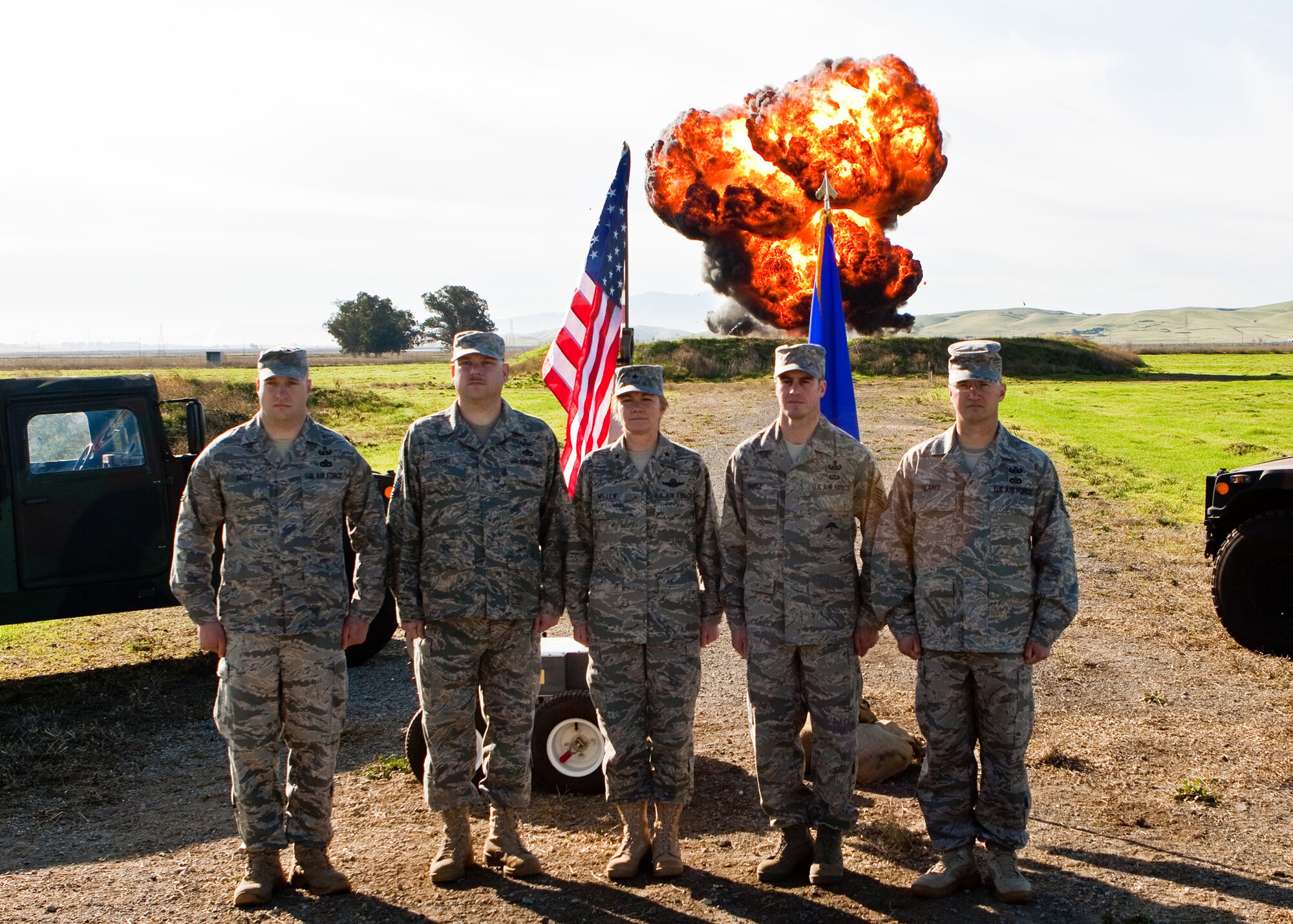 TRAVIS AIR FORCE BASE, Calif. -- During a routine training detonation Nov. 8, Brig. Gen. Maryanne Miller, 349th Air Mobility Wing commander, poses with four members of the 349th Civil Engineer Squadron Explosive Ordinance Disposal Flight who recently returned from Iraq:  Tech. Sgt. James G. Britt, Master Sgt. Patrick J.  Stevens, Tech. Sgt. Jason C. Marez and Tech. Sgt. Jerry L. Glance.  Sergeant Britt was awarded the Bronze Star Medal and the Air Force Combat Action Medal for his service during his deployment; the other three Airmen also earned AFCAMs.  The flight was named the 4th Air Force EOD Flight of the Year. (U.S. Air Force photo / Lt. Col. Craig R. Wells)