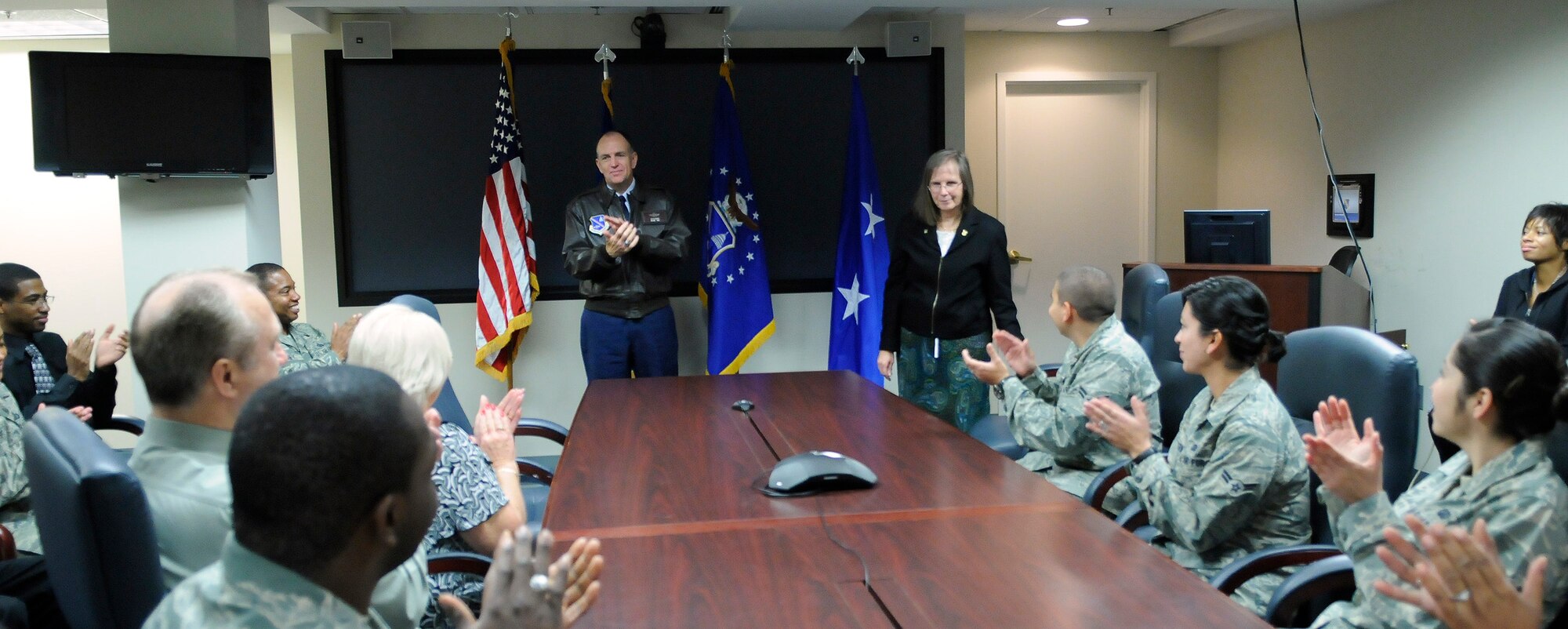 Maj. Gen. Ralph Jodice, Air Force District of Washington commander, pins a 40-year federal career service pin onto the lapel of Norma Lapchak, civilian pay technician since 2001 for the 11th Comptroller Squadron during a brief ceremony at Bolling Air Force Base Nov. 12. Eligibility for career service recognition is based on total years of federal service, including all honorable military service.  Ms. Lapchak began her federal service as a clerk typist from 1968-1969 at the Department of Agriculture; then procurement clerk and voucher examiner for the U.S. Government Printing Office from 1969-1974; then procurement clerk, voucher examiner and lead voucher examiner for the Department of the Army from 1974 to 1996; and then procurement technician at Bolling from 1996 to 2001. (U.S. Air Force photo by Senior Airman Alexandre Montes)