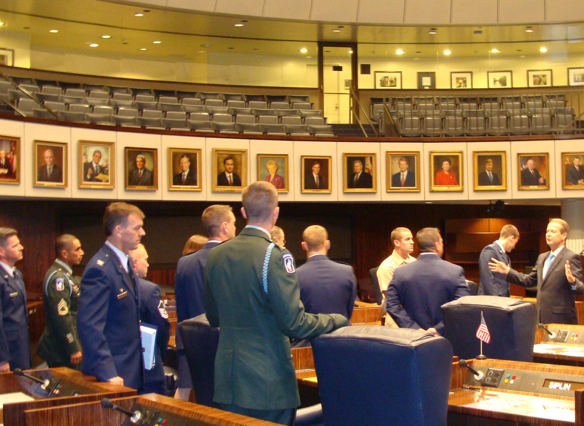 Team Eglin Warriors get a briefing on the Senate floor.  Two dozen Airmen attended the day's events; many are recent returnees from deployments supporting Operations Enduring Freedom and Iraqi Freedom. (courtesy photo) 

                            