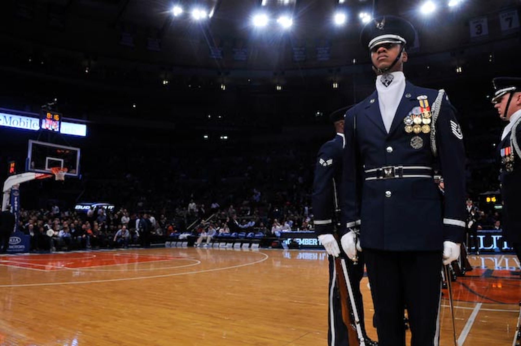 Tech. Sgt. Robert Jones, United States Air Force Honor Guard Drill Team flight chief, prepares to walk down and back through the Drill Team’s spinning rifles in their walkthrough sequence during the New York Knick’s halftime show on Military Appreciation Night at New York’s Madison Square Garden Nov. 11. The Drill Team is the traveling component of the U.S. Air Force Honor Guard and tours worldwide representing all Airmen while showcasing Air Force precision and professionalism. (U.S. Air Force photo by Senior Airman Marleah Miller)