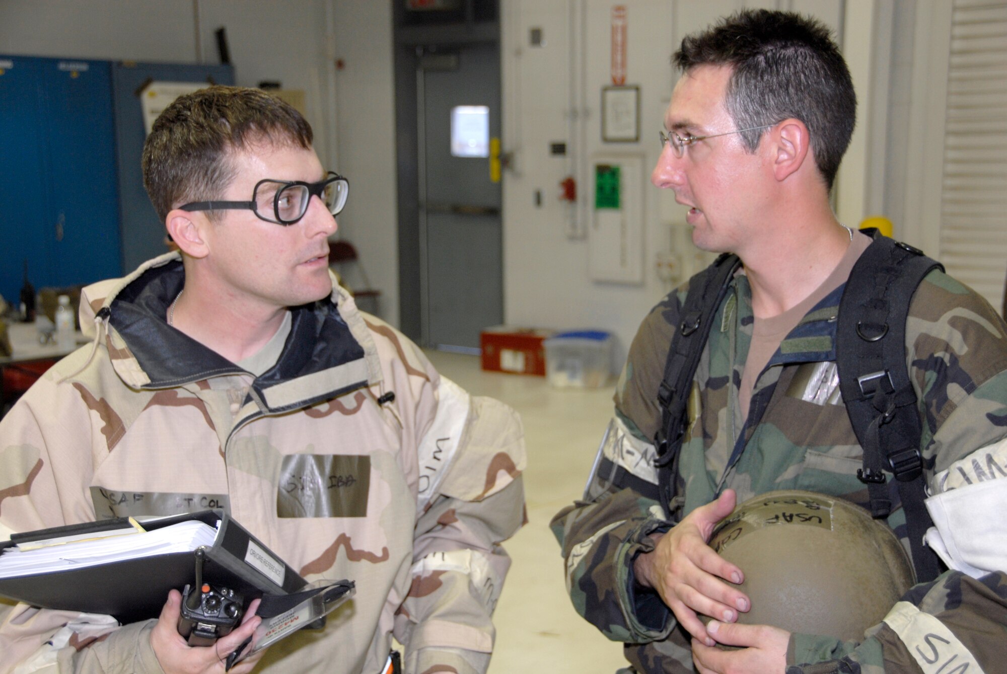 Chaplain, Capt., Ben Hayden, right, talks about an exercise scenario with Lt. Col. Jeff Morris, the 442nd Fighter Wing's staff judge advocate, Sept. 18, 2009.  Chaplain Hayden came to the ministry after an injury cut short his college baseball career.  He is the 442nd Fighter Wing's junior commissioned chaplain.  The 442nd Fighter Wing is an Air Force Reserve unit based at Whiteman Air Force Base, Mo. (U.S. Air Force photo/Staff Sgt. Kent Kagarise) 