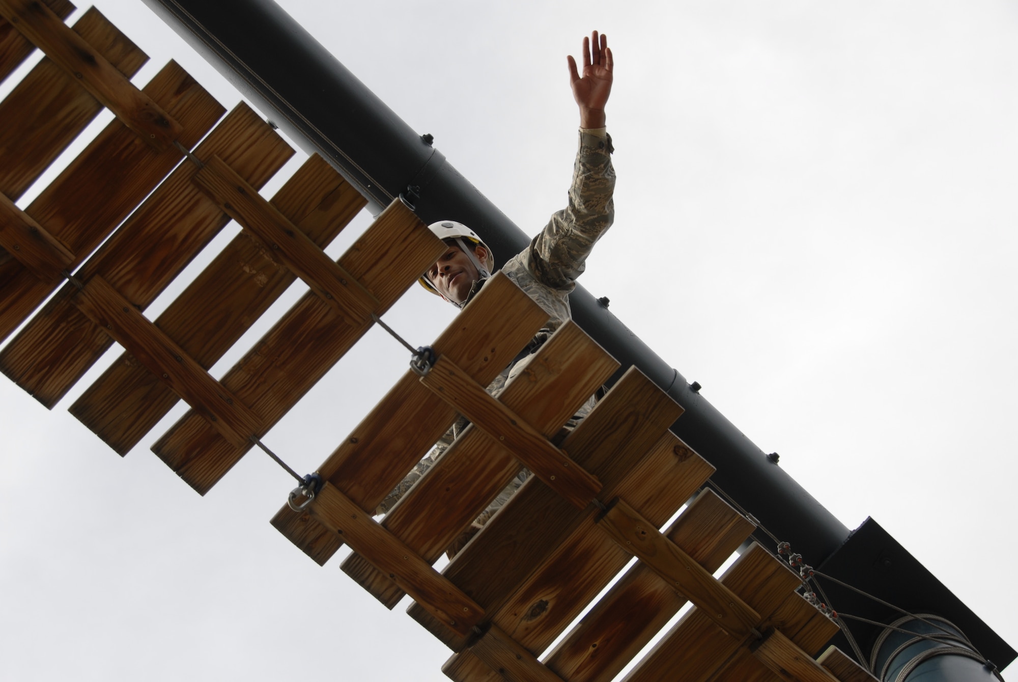 HANSCOM AIR FORCE BASE, Mass. - Airman 1st Class Ronald Ashley, 66th Security Forces Squadron, balances on one of four sections to the approximately 20-foot high Big Blue Monster, an exercise designed to build teamwork, communication and confidence on the U.S. Air Force Academy's Adventure Based Learning Course in Colorado Springs, Colo. 28 Hanscom Airmen traveled to the Academy Nov. 5 through 8 to develop camaraderie, observe cadet training, and experience Air Force Academy athletic events. (U.S. Air Force Photo by Capt. Geoff Buteau)