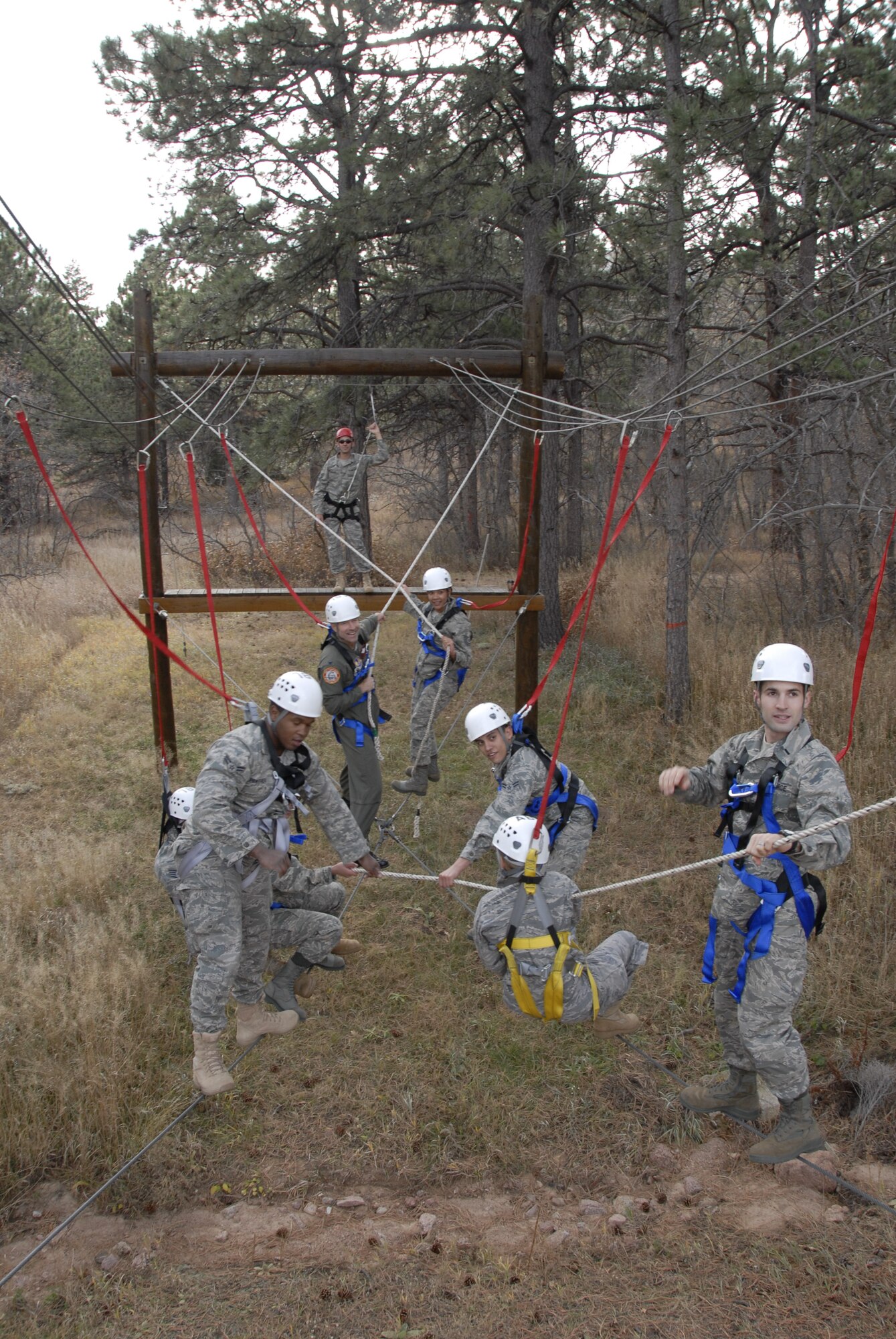 HANSCOM AIR FORCE BASE, Mass. - Two teams from Hanscom engage in Bottleneck, an exercise designed to build teamwork, communication and problem-solving skills on the U.S. Air Force Academy's Adventure Based Learning Course in Colorado Springs, Colo. 28 Hanscom Airmen traveled to the Academy Nov. 5 through 8 to build camaraderie, observe cadet training, and experience Air Force Academy athletic events. (U.S. Air Force Photo by Capt. Geoff Buteau)