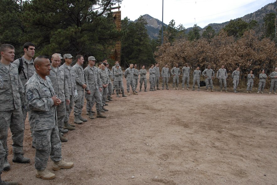 HANSCOM AIR FORCE BASE, Mass. - Senior Master Sgt. Raul Ruiz, 66th Air Base Wing first sergeant, addresses a group of Hanscom Airmen and U.S. Air Force Academy cadets about officer expectations during a team-building exercise at the Academy's Adventure Based Learning Course in Colorado Springs, Colo., Nov. 6. The 28 Hanscom Airmen returned from their four-day trip to the Academy Nov. 8. (U.S. Air Force photo by Capt. Geoff Buteau)