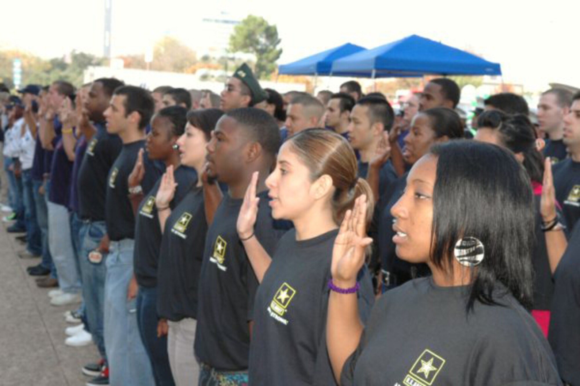 During a special Veterans Day ceremony in Dallas, Texas, Nov. 11 more than 100 individuals were sworn-in as the newest enlistees in the Army, Navy, Marines and Air Force. Maj. Gen. Tom Travis, commander, 59th Medical Wing, administered the oath prior to the start of the Dallas Veterans Day Parade.  (Courtesy photo)