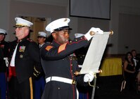 Master Sgt. Derrick Craft reads the traditional Marine Corps birthday message from the 13th Commandant of the Marine Corps, Gen. John Lejeune, Nov. 6 at the Gateway Club. Since 1921, General Lejeune's inspirational birthday message has been read each year during the Corps' birthday celebration. (U.S. Air Force photo/Alan Boedeker) 