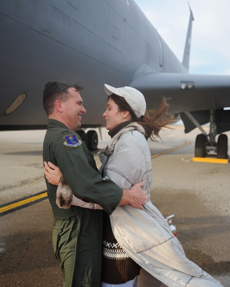 Col. John E. Michel, 319th Air Refueling Wing commander, embraces his wife, Holly, after his final flight as the 319th ARW commander Nov. 10 at Grand Forks Air Force Base. Colonel Michel will relinquish command of the 319th ARW to Col. Donald L. Shaffer during a change-of-command ceremony Nov. 13. (U.S. Air Force photo by Staff Sgt. Suellyn Nuckolls)