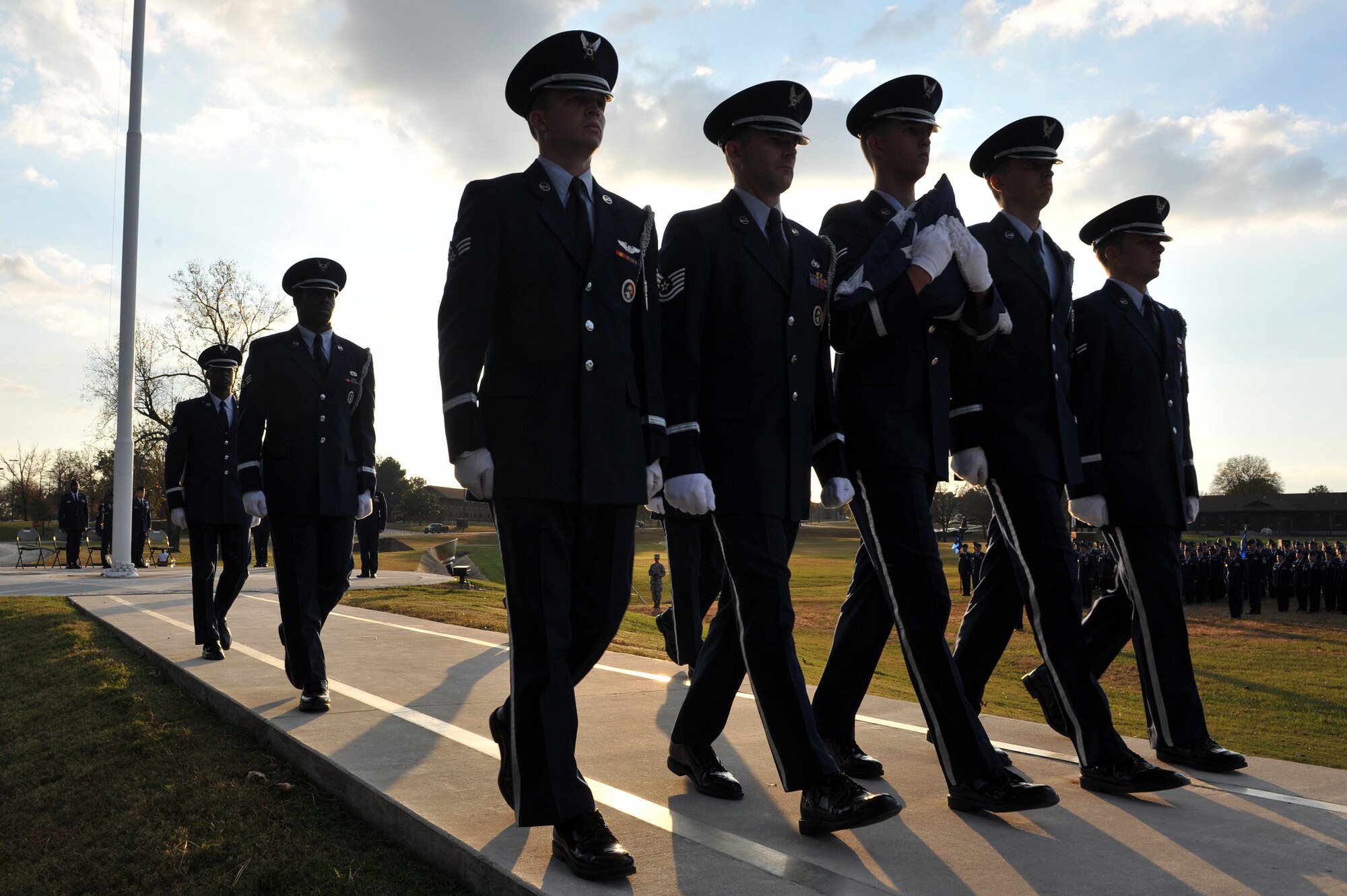 Members of the Little Rock Air Force Base Honor Guard march an American flag away after a Veterans Day retreat Nov. 10 on base. On June 1, 1954, Congress voted to change Nov. 11 from “Armistice Day” to “Veterans Day” to honor American Veterans of all wars.  (U.S. Air Force photo by Staff Sgt. Chris Willis)