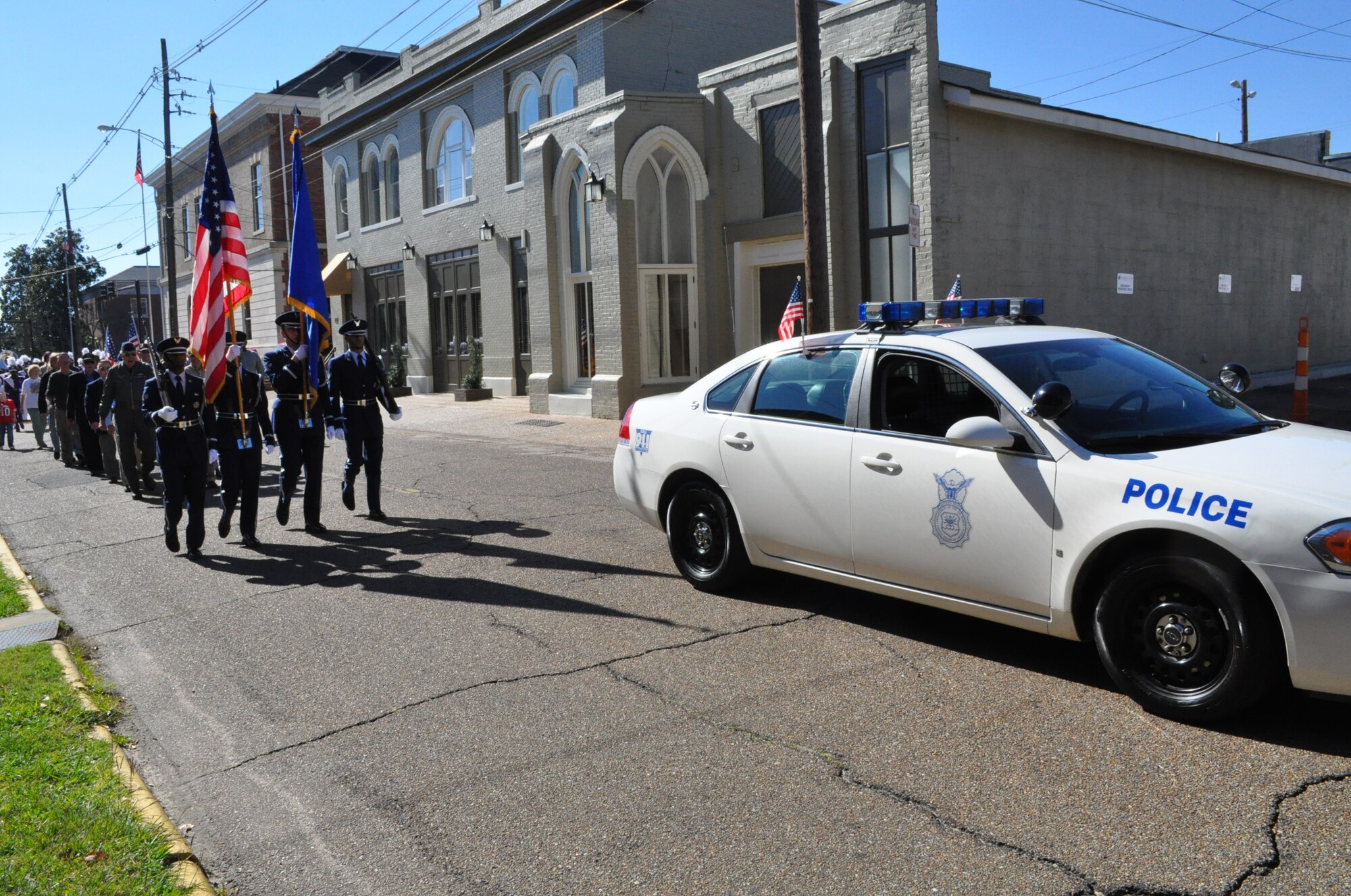Members of the 14th FTW Honor Guard and 14th Security Forces Squadron lead the annual Veteran’s Day Parade in downtown Columbus Nov. 7. (U.S. Air Force photo/Sonic Johnson)
