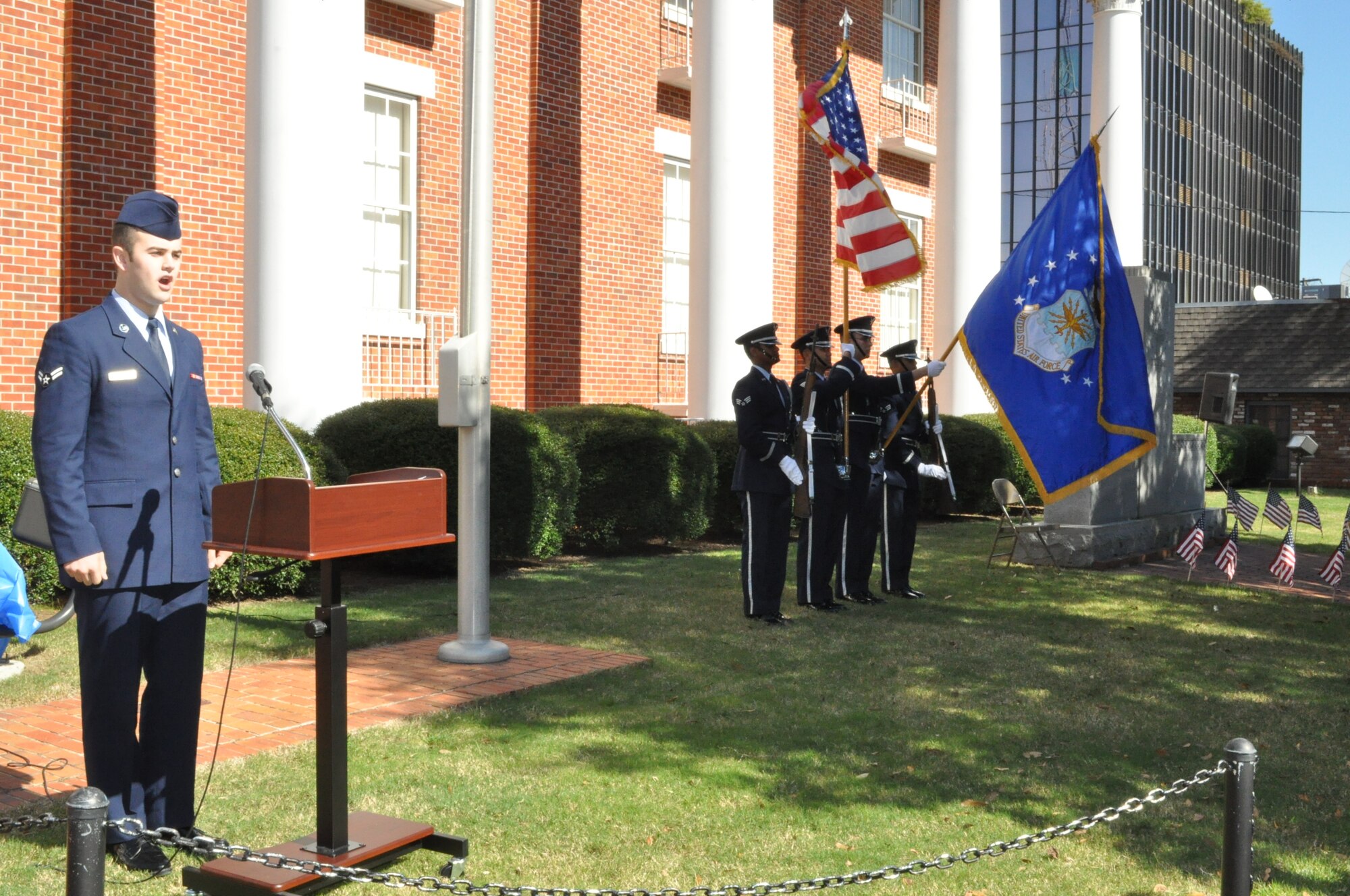 Airman First Class Benjamin Mitchell, 14th Flying Training Wing, sings The National Anthem as the Columbus Air Force Base Honor Guard presents the American flag during the City of Columbus Veterans Day Ceremony on Saturday, November 7 in front of the Lowndes County Courthouse. (U.S. Air Force photo/Sonic Johnson)