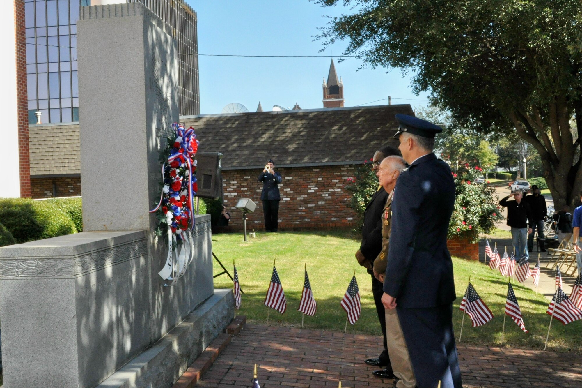 The lone bugler performs “Taps” after Col. Roger Watkins, 14th Flying Training Wing commander; Lon Clemmons, WWII veteran; and Mayor Robert Smith, city of Columbus, laid a wreath at the Lowndes County Veterans Memorial during the Columbus Veterans Day Ceremony Nov. 7. (U.S. Air Force photo/Sonic Johnson)