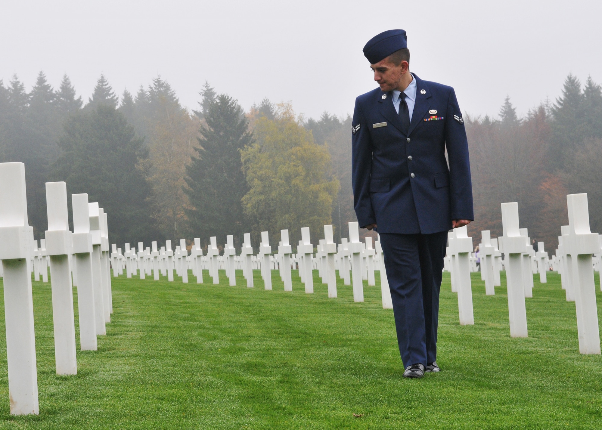 SPANGDAHLEM AIR BASE, Germany -- Airman 1st Class Michael D. Kimball, 52nd Operations Support Squadron, looks at graves of fallen World War II soldiers at the Luxembourg-American Cemetery and Memorial in Luxembourg City, Nov. 11. More than 5,000 American servicemembers from World War II now rest at the 50.5 acre cemetery, which is one of 14 American cemeteries established overseas after World War II. (U.S. Air Force photo/Airman 1st Class Nick Wilson)