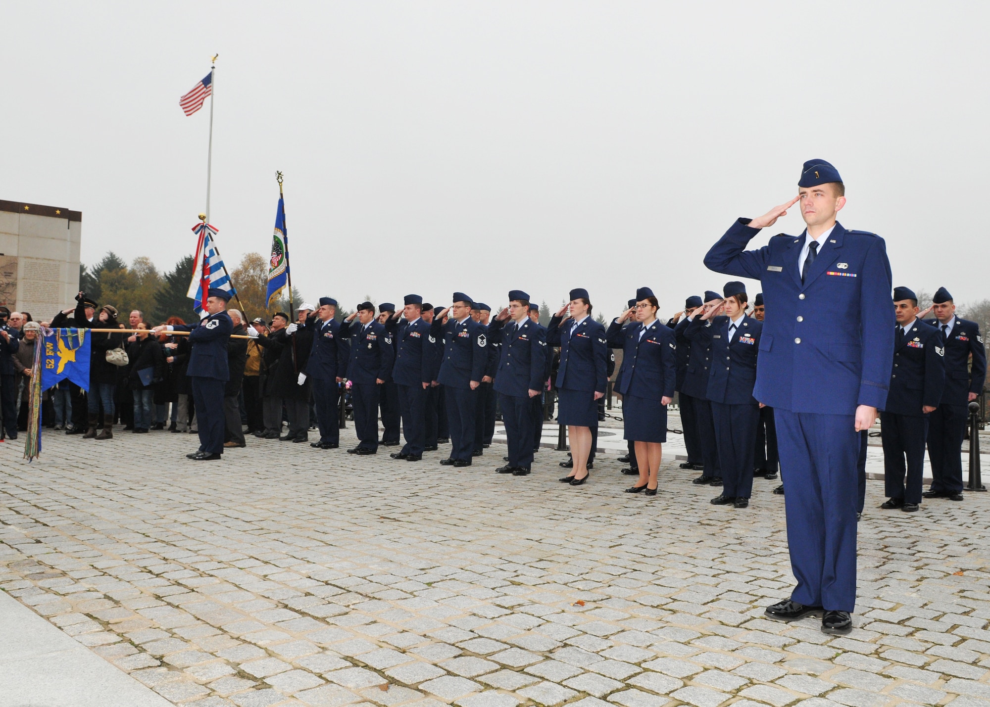 SPANGDAHLEM AIR BASE, Germany -- Members of the 52nd Fighter Wing salute during the national anthem at the annual Veterans Day ceremony at the Luxembourg American Cemetery and Memorial in Luxembourg City Nov. 11. More than 5,000 American servicemembers from World War II now rest at the 50.5 acre cemetery, which is one of 14 American cemeteries established overseas after World War II. (U.S. Air Force photo/Airman 1st Class Nick Wilson)
