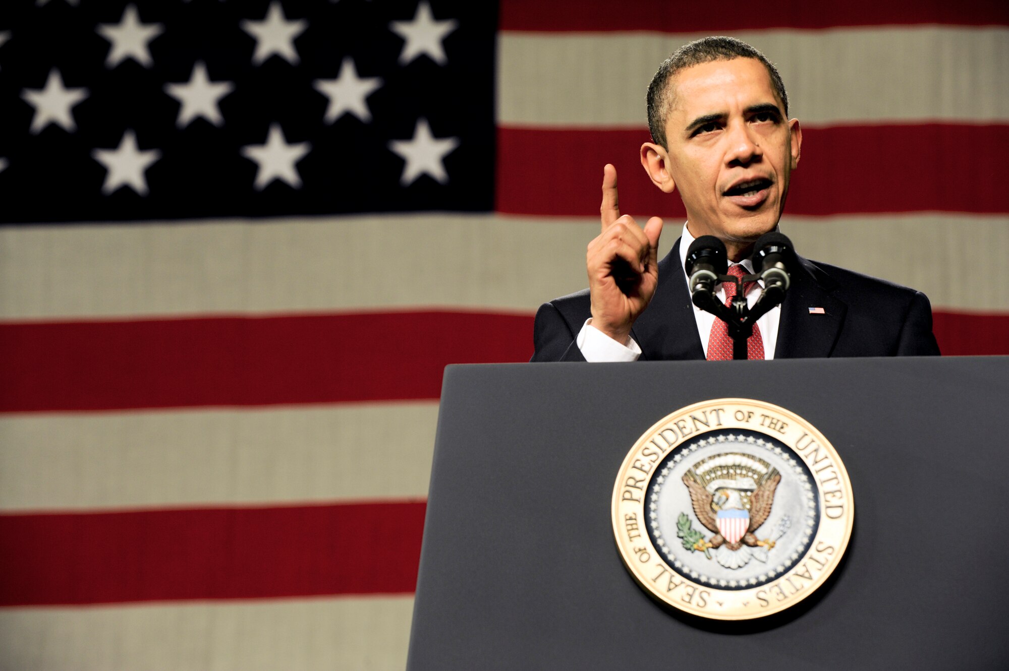 President Barack Obama gives a speech to a crowd of military personnel and civilians gathered Nov. 12, 2009, at Elmendorf Air Force Base, Alaska. The president was at the base to meet with servicemembers and offer remarks to the local community.(U.S. Air Force photo/Staff Sgt. Joshua Garcia)
