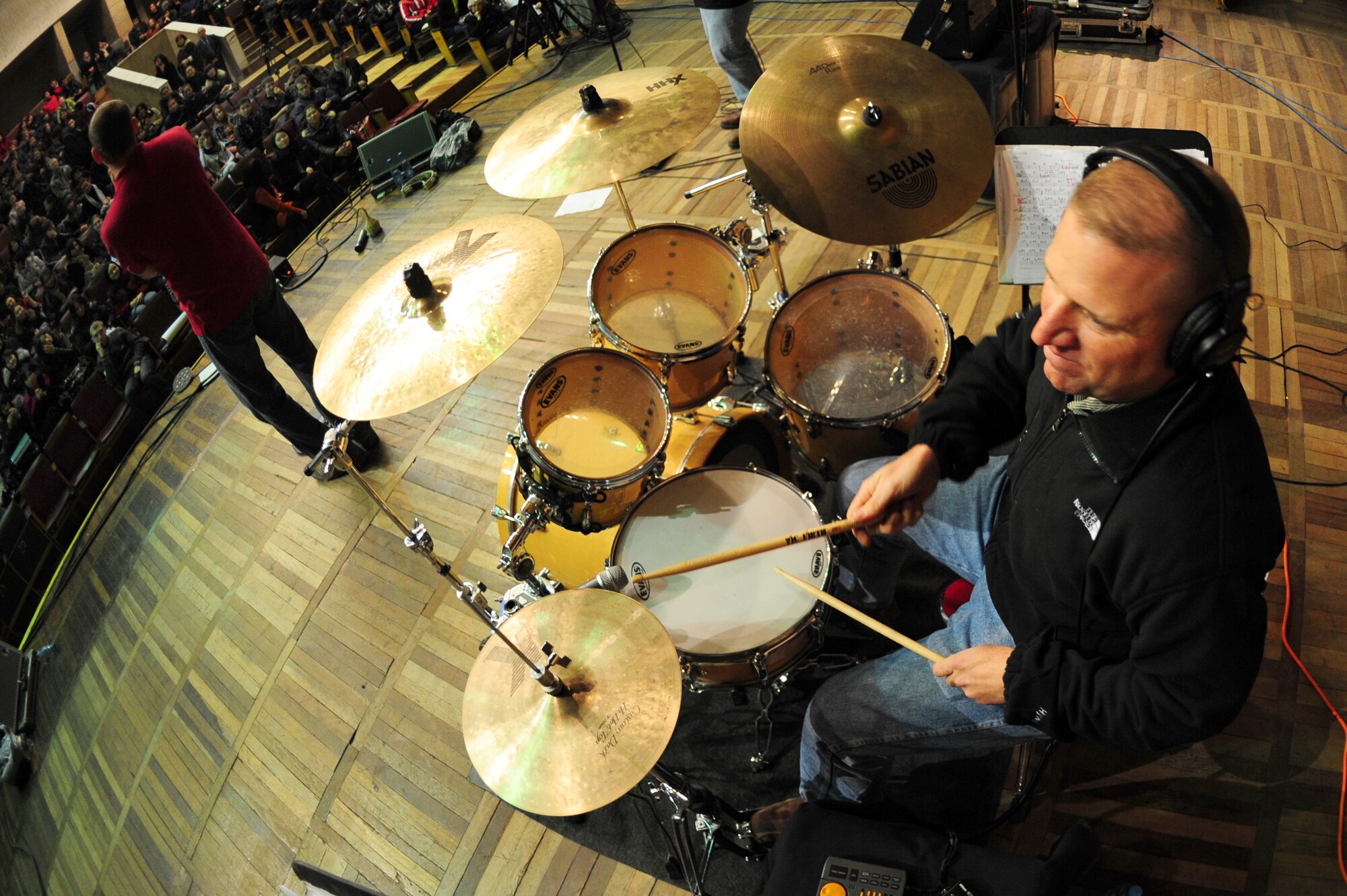 BISHKEK, Kyrgyzstan -- Master Sgt. Anthony DeLuzio, U.S. Air Forces Central Sirocco Band drummer, performs at the Kyrgyz-Russian Slavic University, Nov. 13, 2009. The Sirocco Band performs a wide variety of rock, oldies and pop music while touring Central Asia. The band members are deployed from Lackland Air Force Base, Texas. (U.S. Air Force photo/Senior Airman Steele C. G. Britton)
