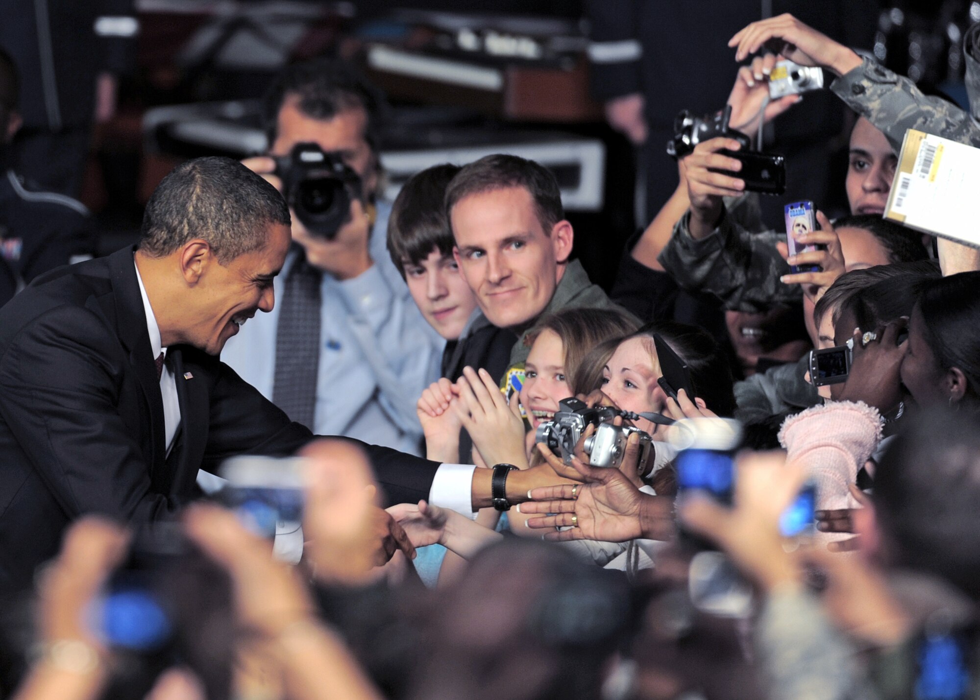 President Barack Obama shakes hands with military personnel and civilians during his visit Nov. 12, 2009, to Elmendorf Air Force Base, Alaska. The president was at the base to meet with servicemembers and offer remarks to the local community.(U.S. Air Force photo/Senior Airman Laura Turner)
