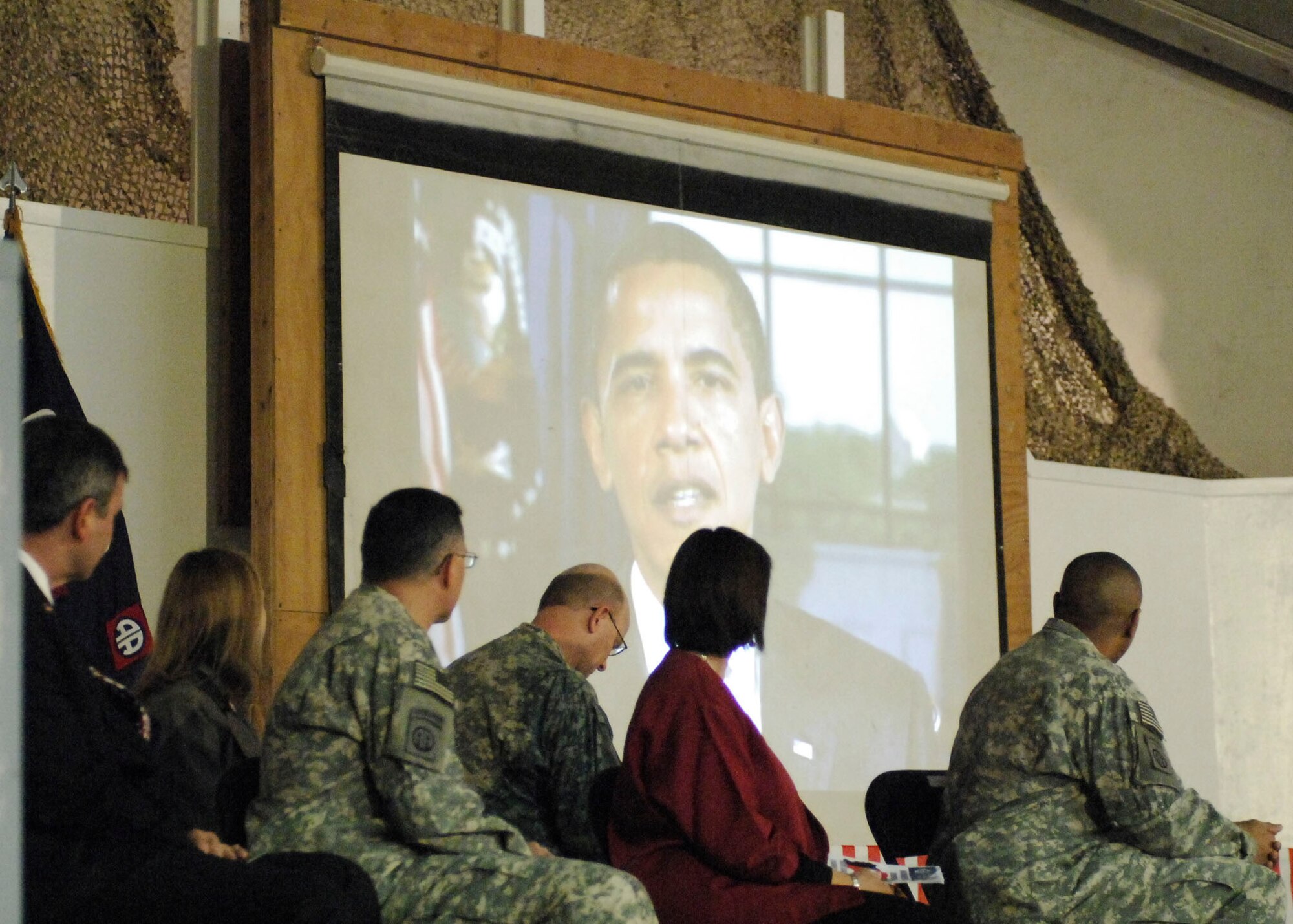 BAGRAM AIRFIELD, Afghanistan -- For the first time in Afghanistan, a taped video message from President Barack Obama was shown, congratulating the newest citizens of the U.S.  "This is now officially your country," said Obama. "In America, no dream is impossible. Together we can keep the beacon of America bright enough for all the world to see."  (U.S. Air Force photo/Senior Airman Felicia Juenke)