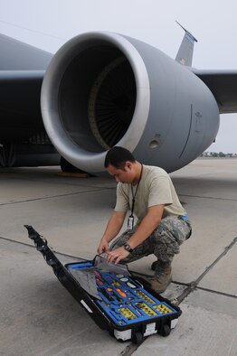 Staff Sergeant Shin conducts pre-flight toolkit check before overseas deployment (U.S. Air Force Photo/Capt. Shane Huff)