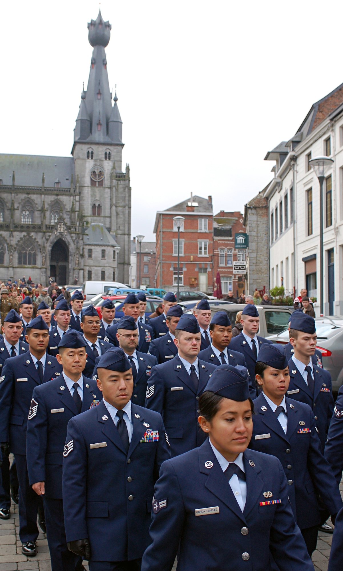 SPANGDAHLEM AIR BASE, Germany – The 606th Air Control Squadron marches down the streets of Walcourt, Belgium, during a memorial service on Armistice Day, Nov. 11. Belgians and Americans convened for the majority of the day in the town church, at two memorials and for lunch before settling down to listen to the United States Air Forces in Europe band perform. (U.S. Air Force photo/Senior Airman Clay Murray)
