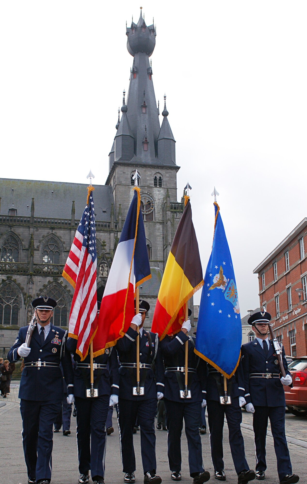 SPANGDAHLEM AIR BASE, Germany – The Spangdahlem Air Base Honor Guard leads a parade of Belgians and Air Force servicemembers down the roads of Walcourt, Belgium, on Armistice Day, Nov. 11, during a memorial service to pay respect to the 20 million who gave their lives during World War I. (U.S. Air Force photo/Senior Airman Clay Murray)