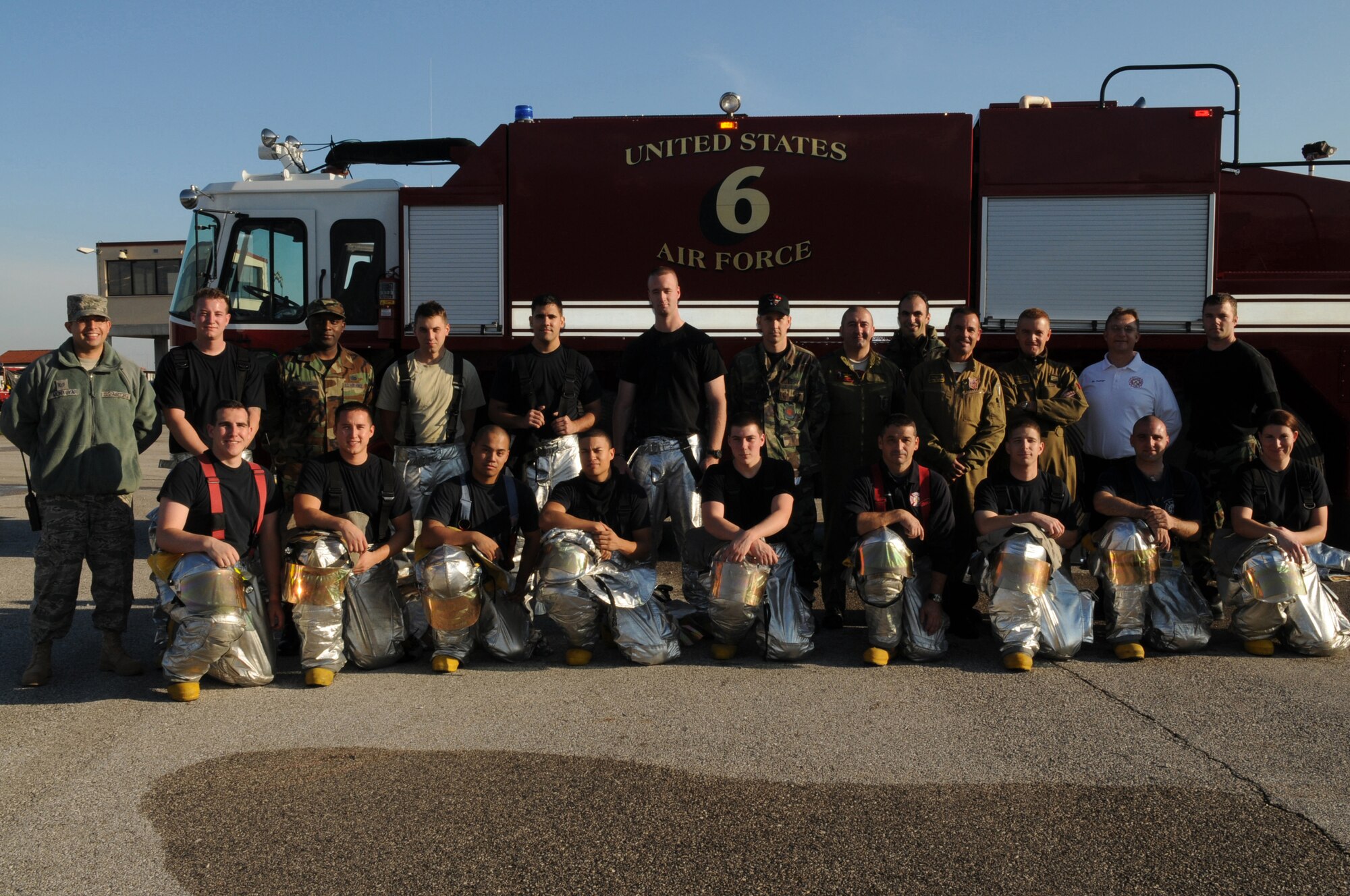 Firefighters from the 31st Civil Engineer Squadron take a group photo with Italian Air Force firefighters from Decimomannu Air Base, Sardinia, Italy following a three-day training course Nov. 11, 2009 at Aviano Air Base, Italy.  The 31st Civil Engineer Squadron hosted a three-day course so that U.S. and Italian Air Force firefighters know the standard operating procedures when conducting a joint response to an F-16 Fighting Falcon aircraft emergency.  The 31st Fighter Wing and other foreign air forces conduct pilot training operations out of Decimomannu AB.
 (U.S. Air Force photo/ Senior Airman Nadine Y. Barclay)