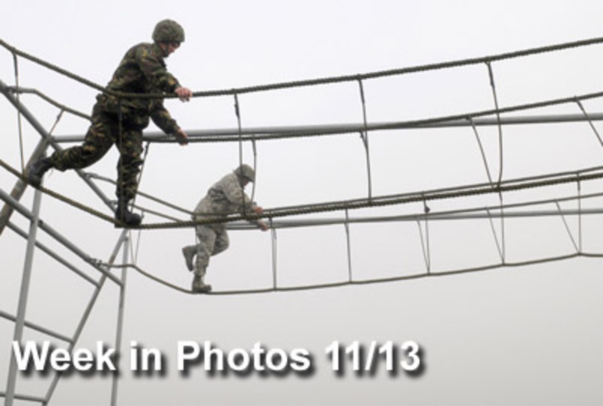 Air Force Week in Photos for Nov. 13 highlights photos from around the Air Force. In this photo by Senior Airman Thomas Trower, a British airman (left) and 1st Lt. Xzavior Hill, 100th Civil Engineer Squadron, traverse a rope bridge as part of the Ultimate Challenge 2  at Royal Air Force Marham, England, Nov. 9, 2009.