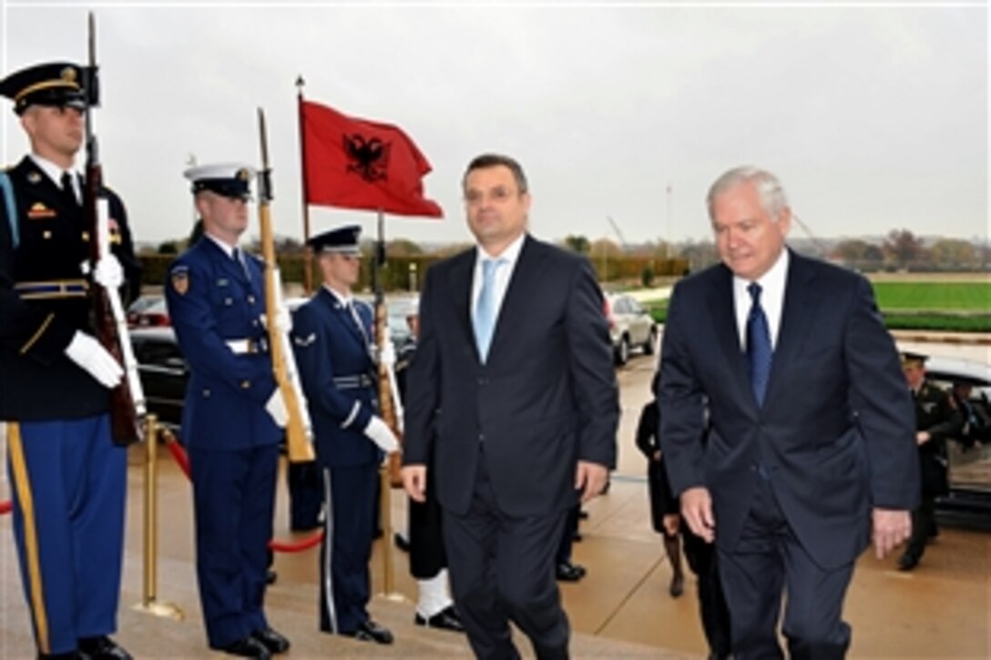 Defense Secretary Robert M. Gates, right, escorts Albanian Defense Minister Arben Imami through an honor cordon into the Pentagon, Nov. 13, 2009, for security talks.