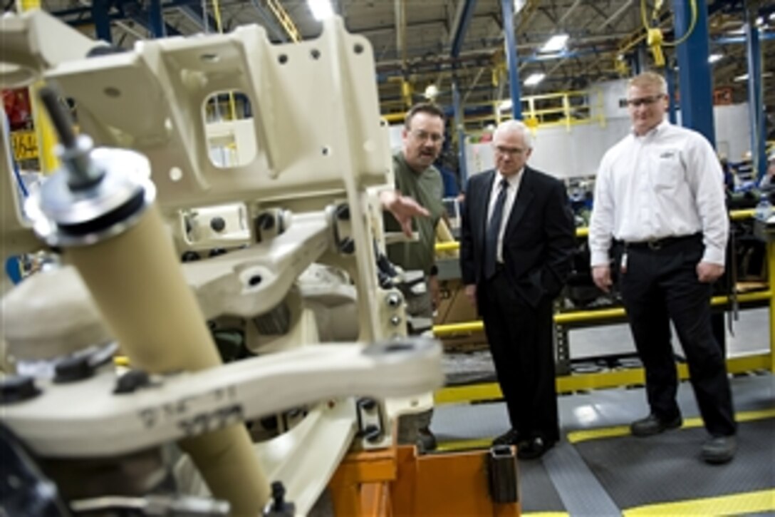 Secretary of Defense Robert M. Gates tours the MRAP-All Terrain Vehicle (M-ATV) production facility in Oshkosk, W.I., on Nov. 12, 2009.  The M-ATV design combines the crew protection war fighters have come to expect in MRAP vehicles with the extreme mobility and durability needed to negotiate mountainous off-road terrain.  