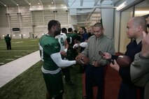 FLORHAM PARK, N.J. -- Marines from Recruiting Station New Jersey meet with Bart Scott, linebacker, New York Jets, during a tour of the team's practice facility Nov. 13. The team invited service members to their practice and Sunday the Jets will honor military veterans during their military appreciation day. (Official Marine Corps photo by Sgt. Randall A. Clinton). The team invited service members to their practice and Sunday the Jets will honor military veterans during their military appreciation day. (Official Marine Corps photo by Sgt. Randall A. Clinton)