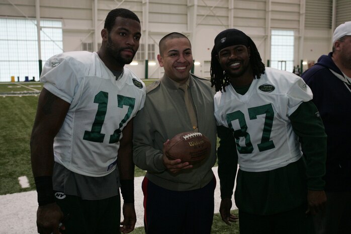 FLORHAM PARK, N.J. -- Marines from Recruiting Station New Jersey meet with Braylon Edwards, #17 wide receiver, New York Jets, and David Clowney, #87 wide receiver, during a tour of the team's practice facility Nov. 13. The team invited service members to their practice and Sunday the Jets will honor military veterans during their military appreciation day. (Official Marine Corps photo by Sgt. Randall A. Clinton)