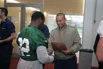 FLORHAM PARK, N.J. -- Marines from Recruiting Station New Jersey meet with Justin Miller, kick returner, New York Jets, during a tour of the team's practice facility Nov. 13. The team invited service members to their practice and Sunday the Jets will honor military veterans during their military appreciation day. (Official Marine Corps photo by Sgt. Randall A. Clinton)