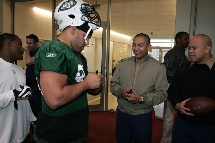FLORHAM PARK, N.J. -- Marines from Recruiting Station New Jersey meet with the New York Jets during a tour of the team's practice facility Nov. 13. The team invited service members to their practice and Sunday the Jets will honor military veterans during their military appreciation day. (Official Marine Corps photo by Sgt. Randall A. Clinton). The team invited service members to their practice and Sunday the Jets will honor military veterans during their military appreciation day. (Official Marine Corps photo by Sgt. Randall A. Clinton)