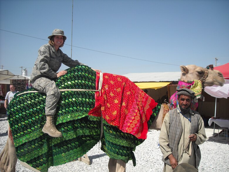 Staff Sgt. Veronica Everest, 43rd Medical Support Squadron, sits on a camel during a bazzar while deployed to Bagram, Afghanistan in June. 