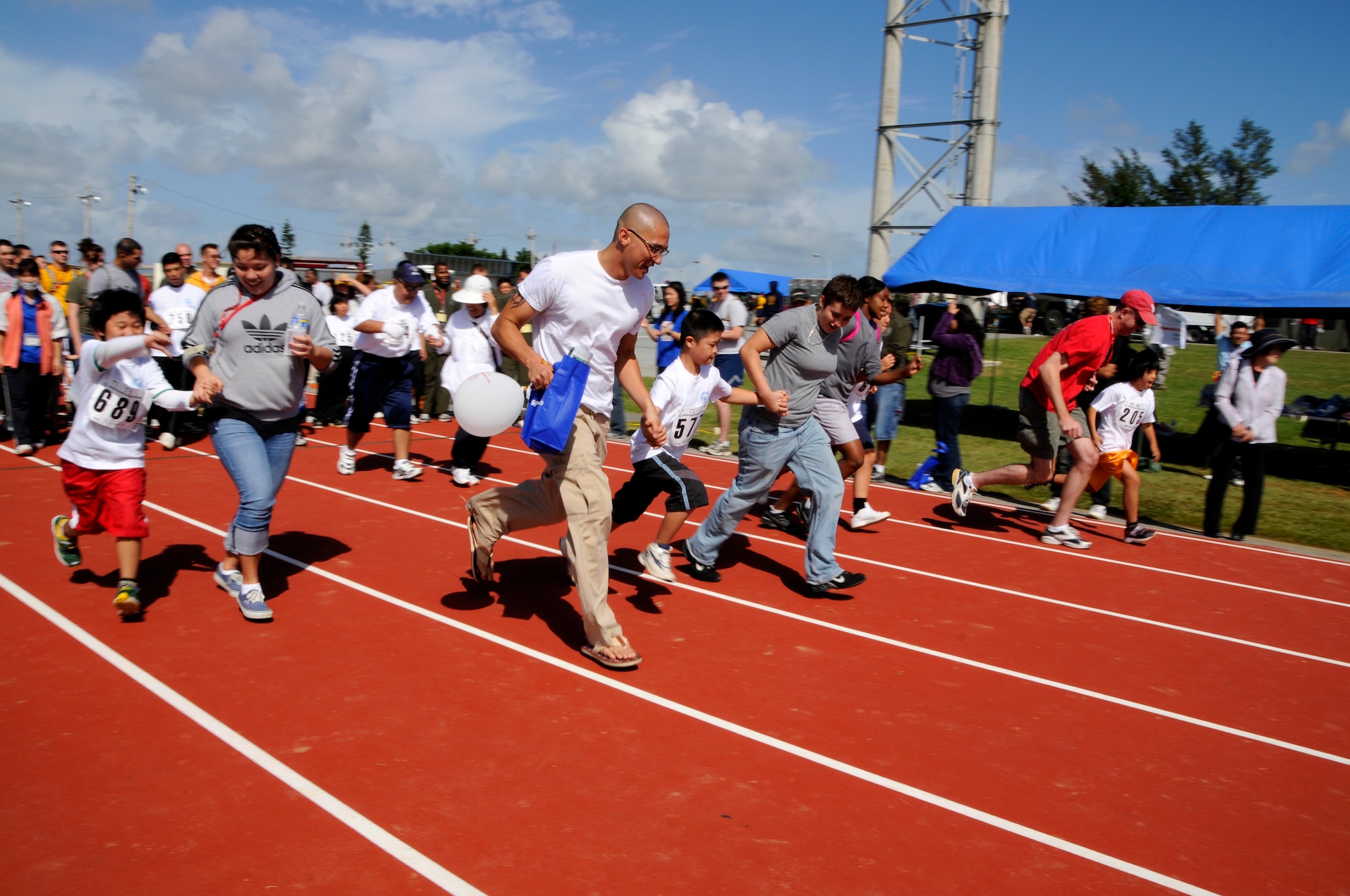 Special Olympics athletes compete in the 30 meter dash during the Kadena Special Olympics Nov. 14, 2009, Kadena Air Base, Japan. Kadena hosted the 10th Annual Special Olympic Games and Art Festival for special needs Okinawan and American adult and child athletes.
(U.S. Air Force photo/Tech. Sgt. Angelique Perez) 