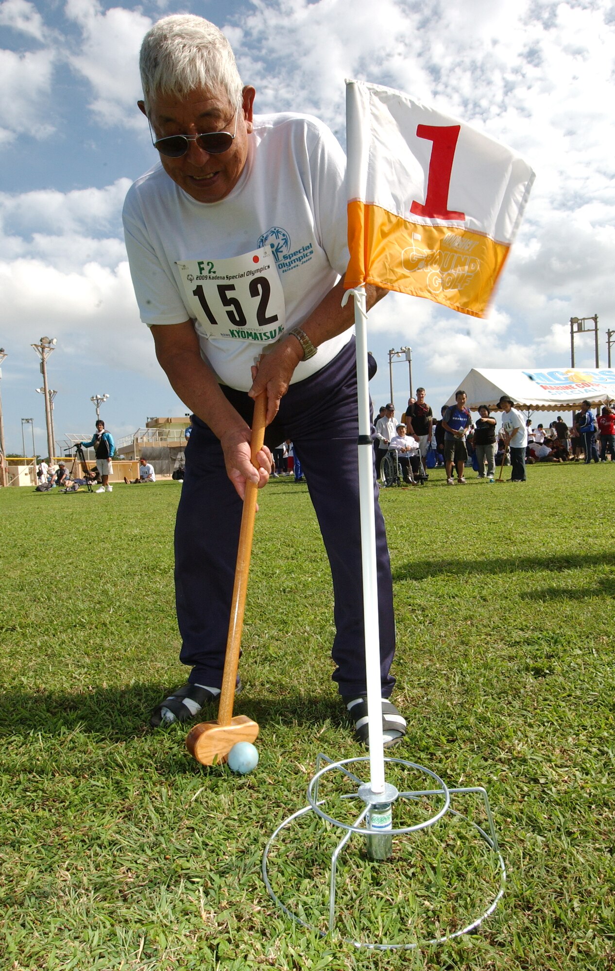 Kakazu Kyomatsu participates in a game of ground golf at the Kadena Special Olympics, held Nov. 14 at Kadena Air Base, Japan. Mr. Kyomatsu, a 78-year-old from Kadena Town, hit a hole-in-one on the final hole.  
(U.S. Air Force photo/Tech. Sgt. Reynaldo Ramon) 
