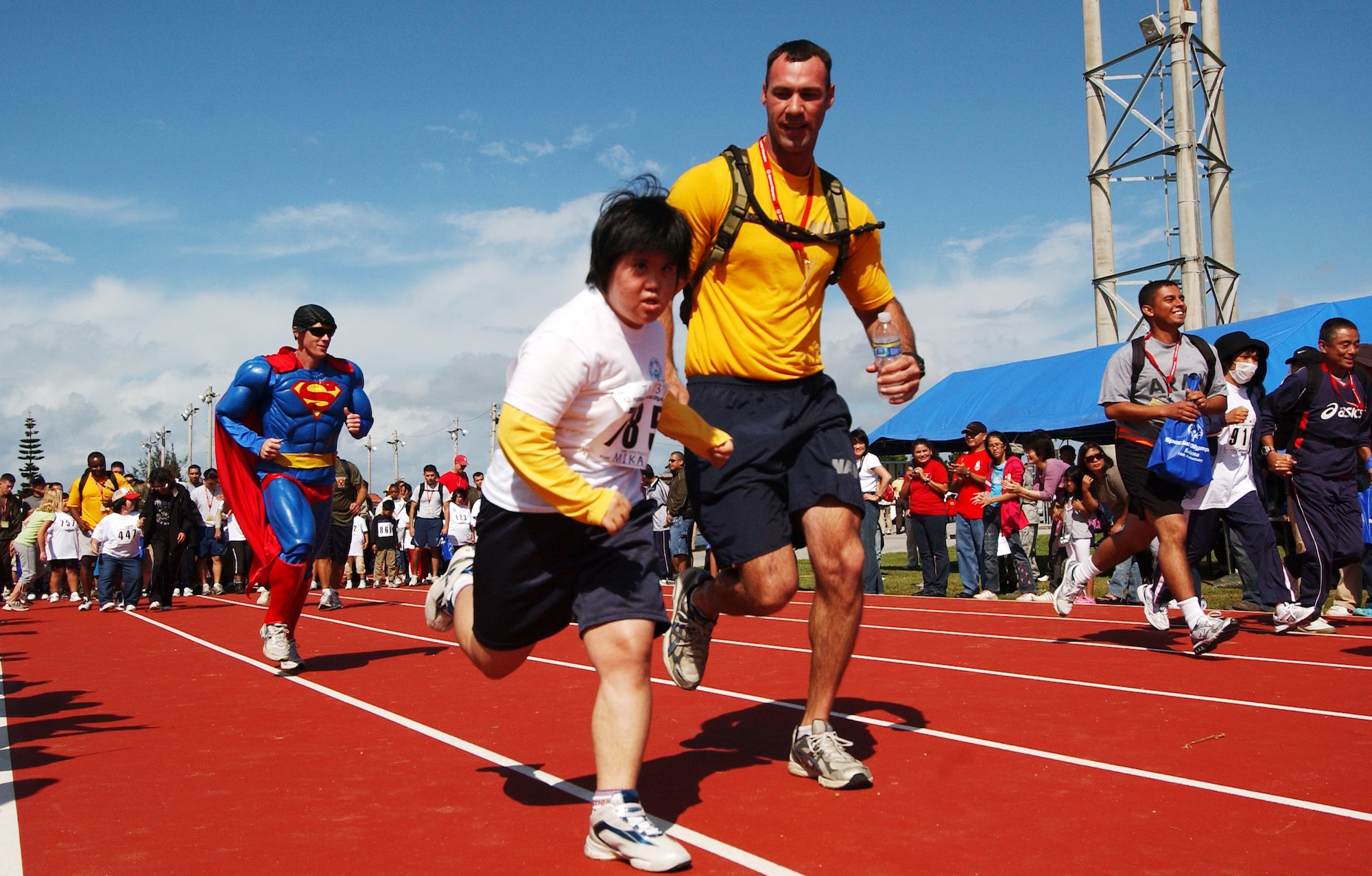 A young Okinawan girl participates in a run during the beginning of Kadena Special Olympics Nov. 14, 2009 at Kadena Air Base, Japan. Kadena hosted the 10th Annual Special Olympic Games and Art Festival for special needs Okinawan and American adult and child athletes.
(U.S. Air Force photo/Tech. Sgt. Reynaldo Ramon) 