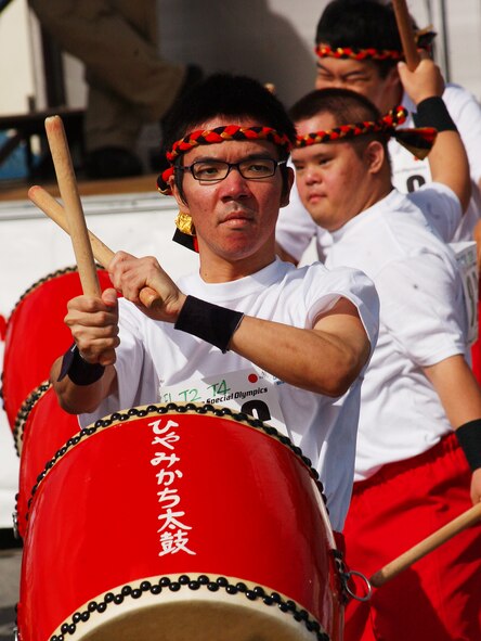 Military members and Okinawans dance to the beat of Taiko drummers during the Kadena Special Olympics, held Nov. 14 at Kadena Air Base, Japan. There were a variety of cultural offerings at the KSO, to include Taiko drumming, Eisa dancing and an art exhibit. (U.S. Air Force photo/Tech. Sgt. Reynaldo Ramon)