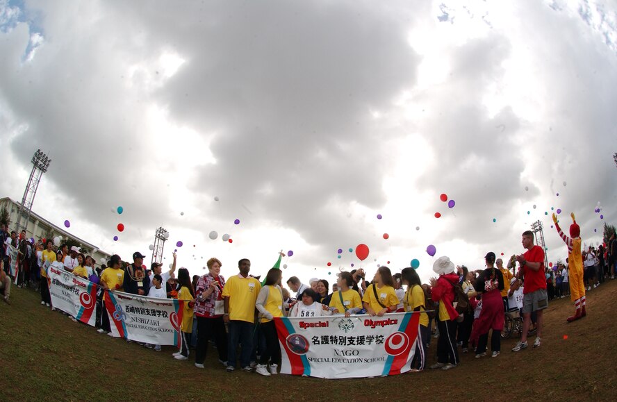 Okinawan and American athletes, along with military volunteers, release balloons into the sky signaling the start of the 10th Annual Kadena Special Olympics, held Nov. 14 at Kadena Air Base, Japan. Approximately 2,000 volunteers helped make the day a success for the 800-plus athletes who registered for the event. (U.S. Air Force photo/Tech. Sgt. Reynaldo Ramon) 

